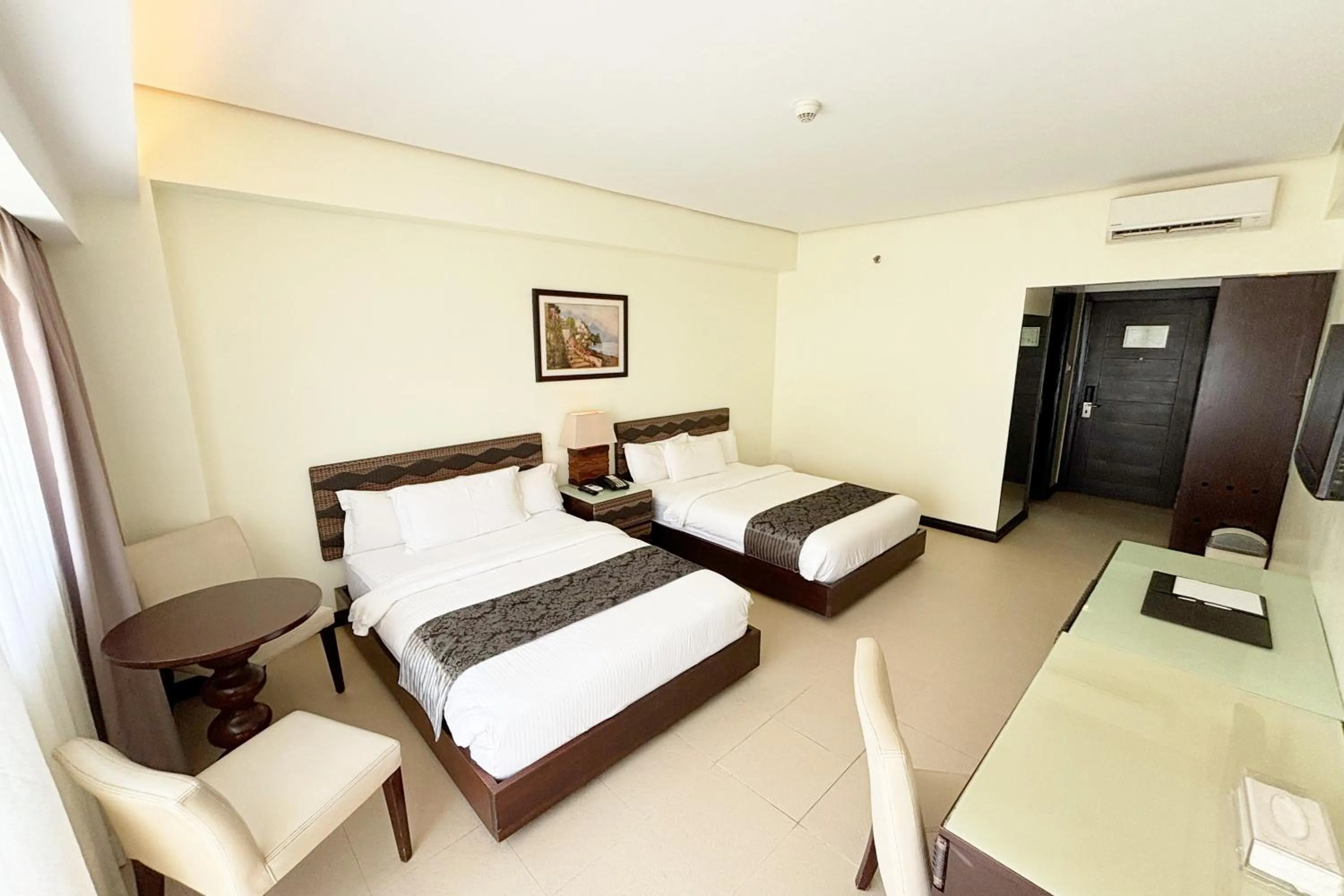 Bed in The Muse Beach Front Hotel Boracay