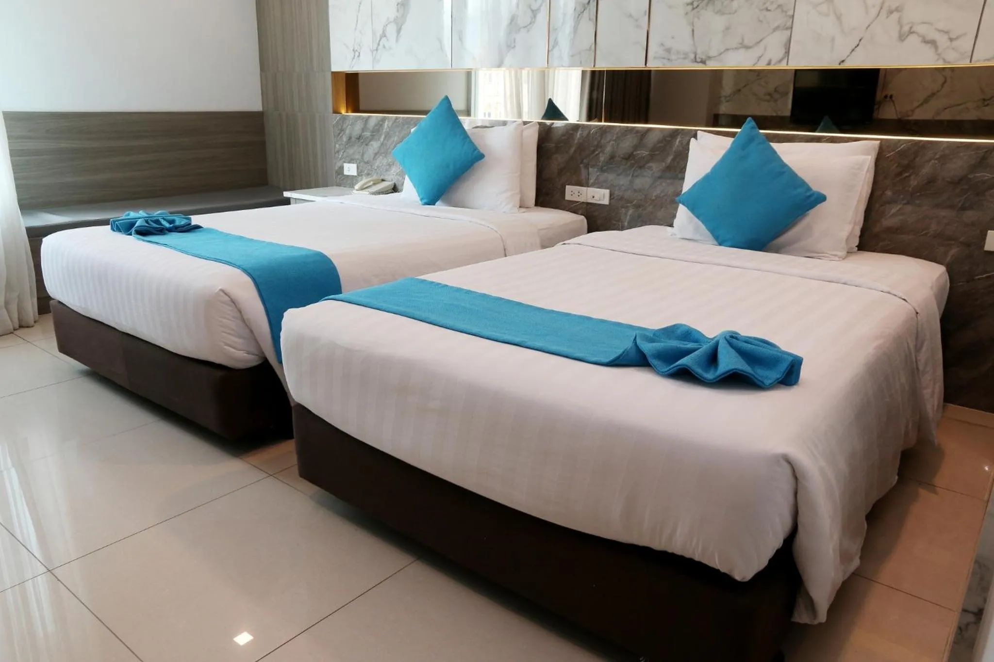 Bed in Crystal Palace Luxury Hotel Pattaya