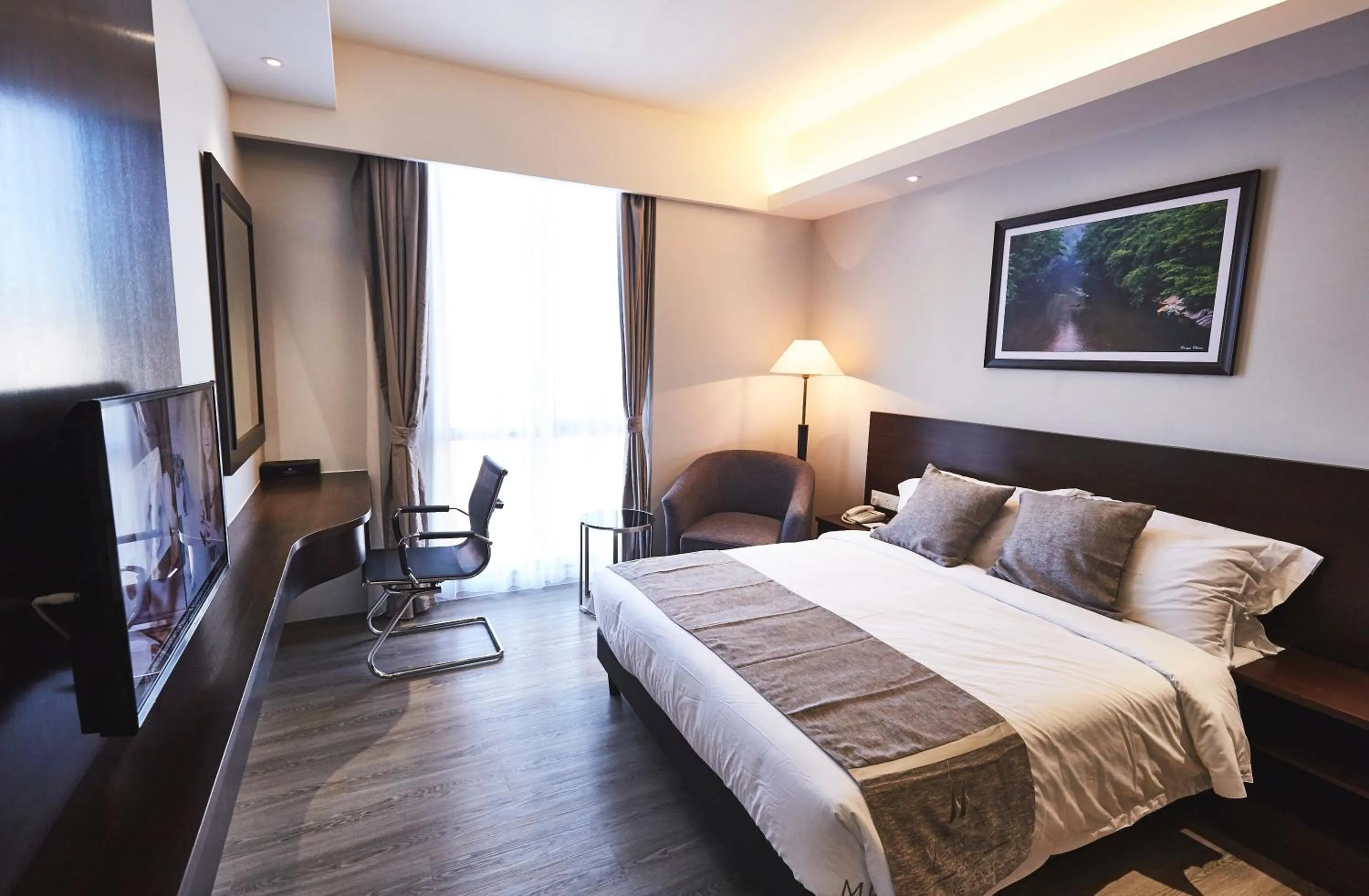 Bed in Meritin Hotel