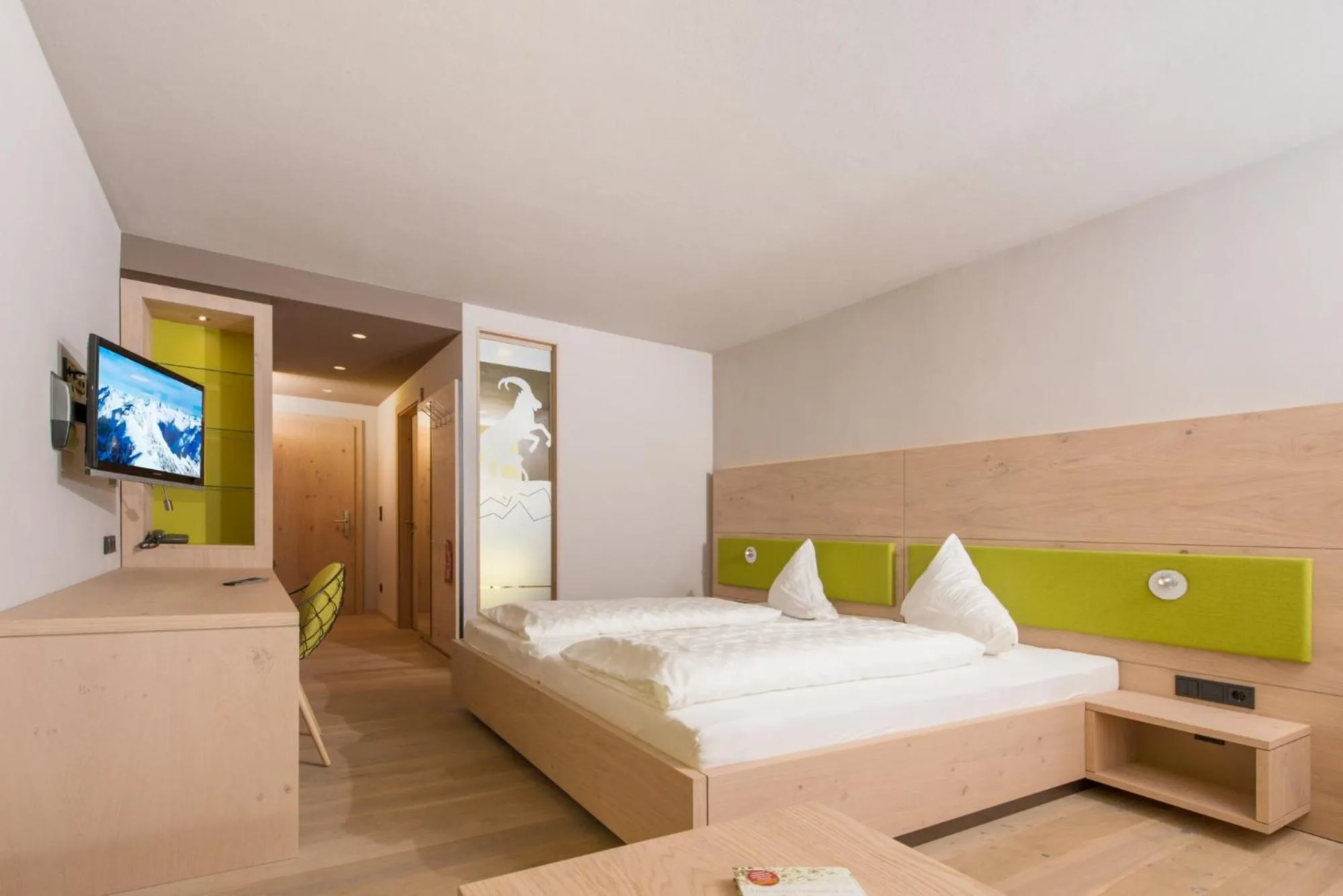 Bed in Familotel Alphotel