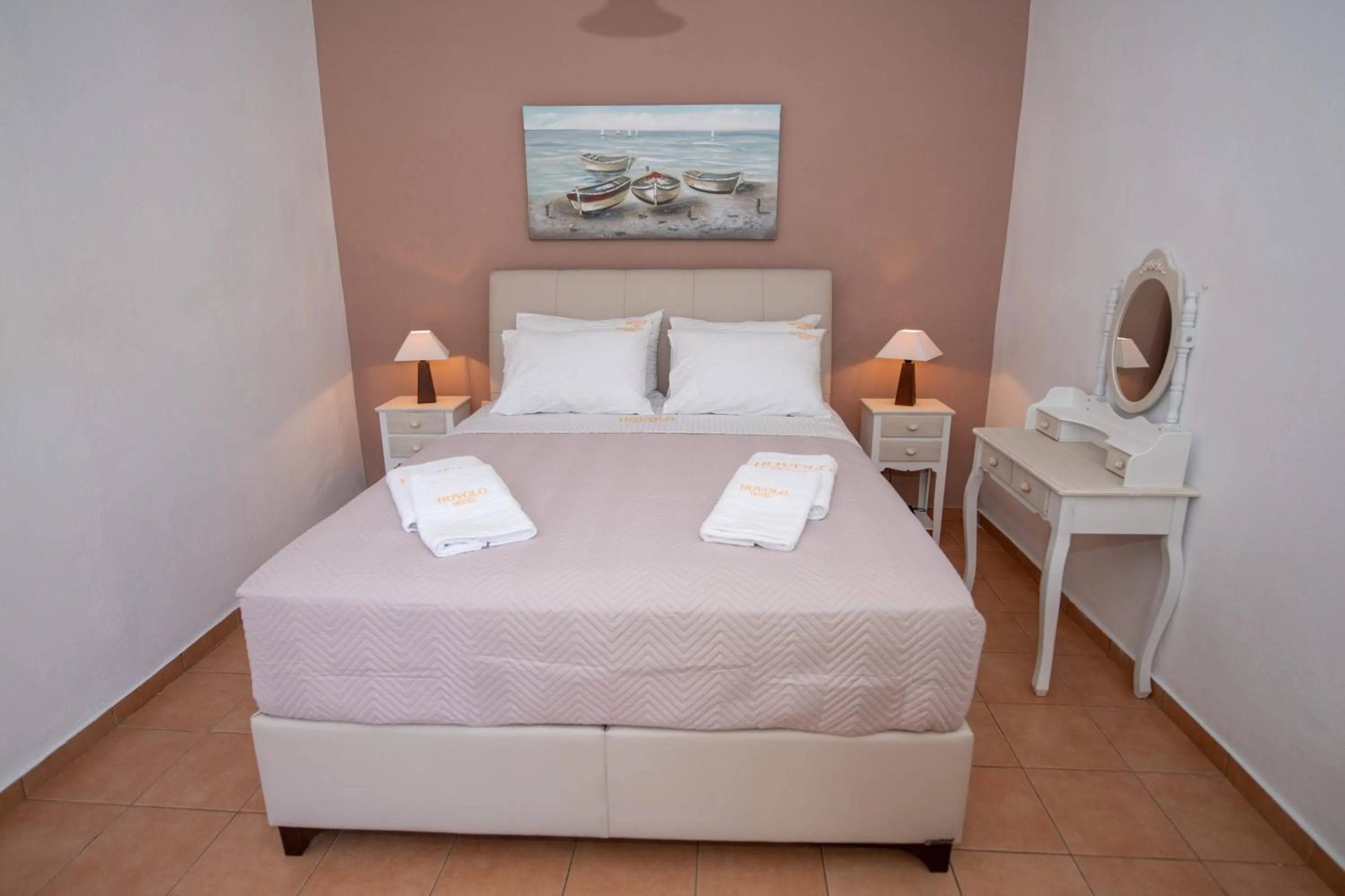 Bed in Hovolo Hotel Apartments