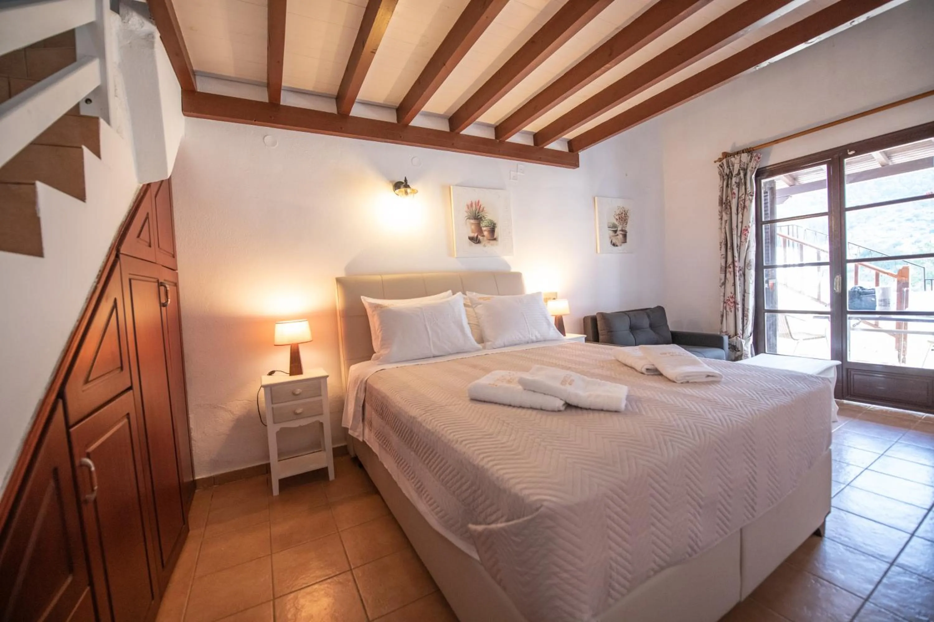 Bed in Hovolo Hotel Apartments