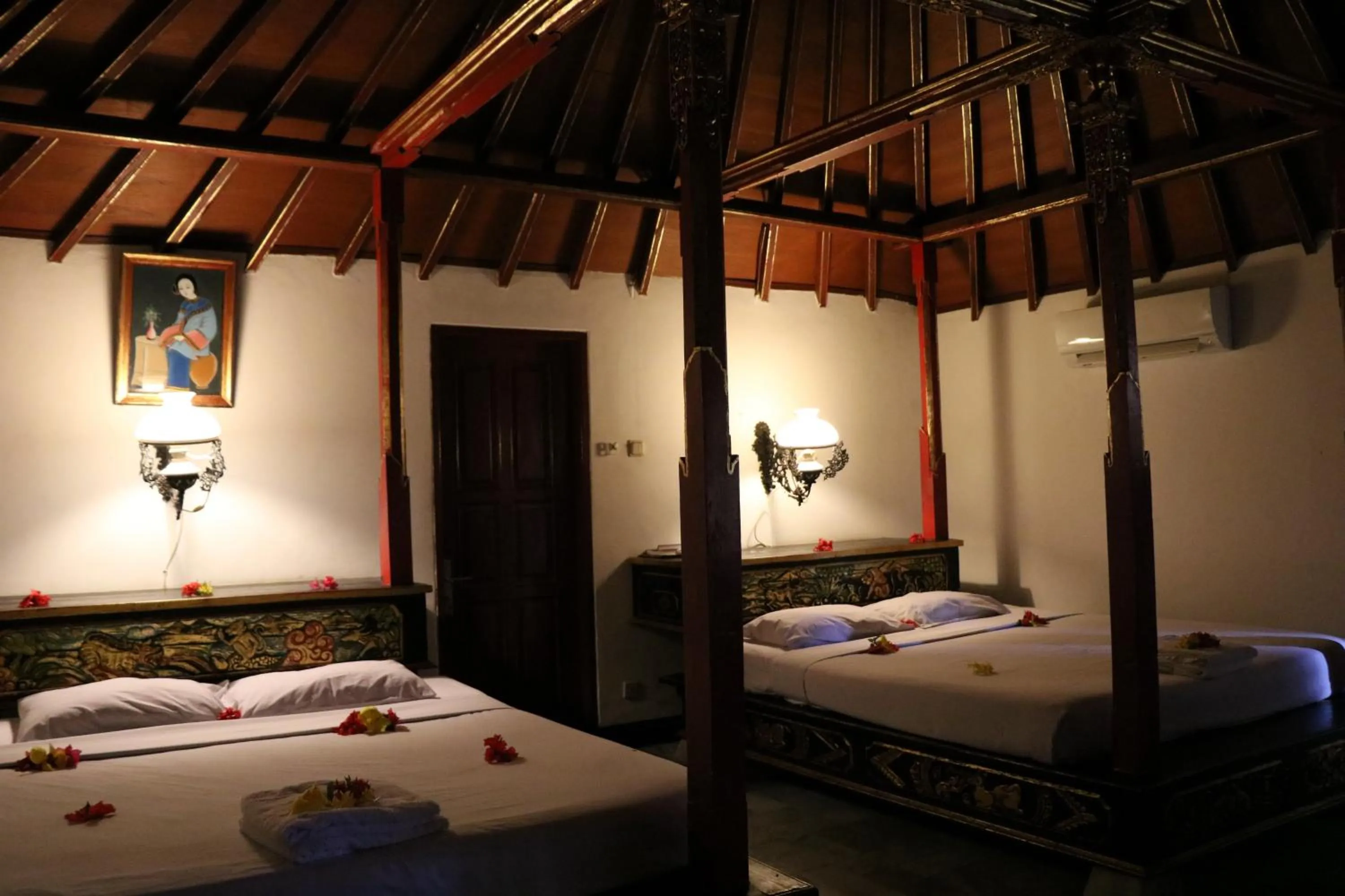 Bed in Puri Bunga Beach Cottages