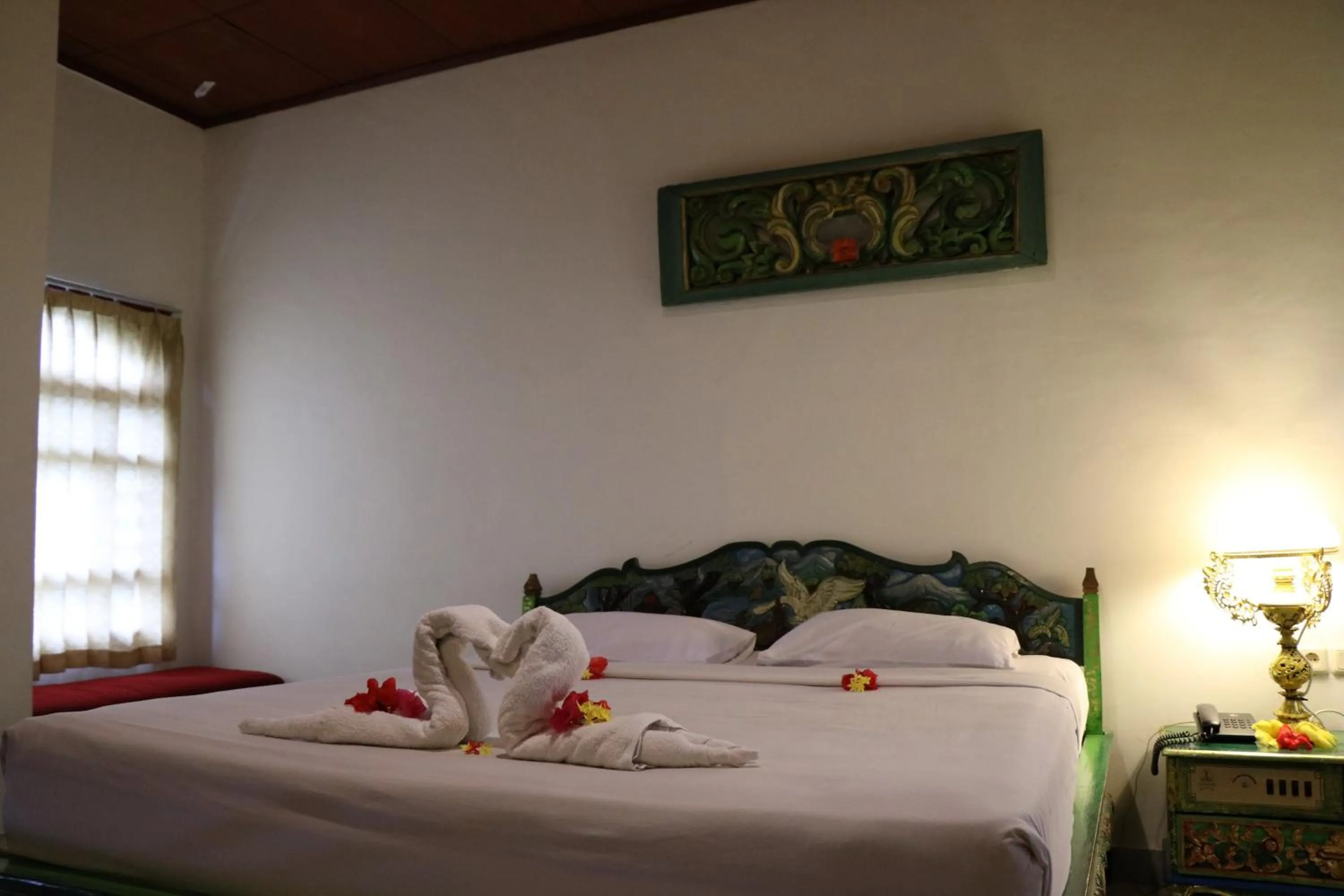 Bed in Puri Bunga Beach Cottages