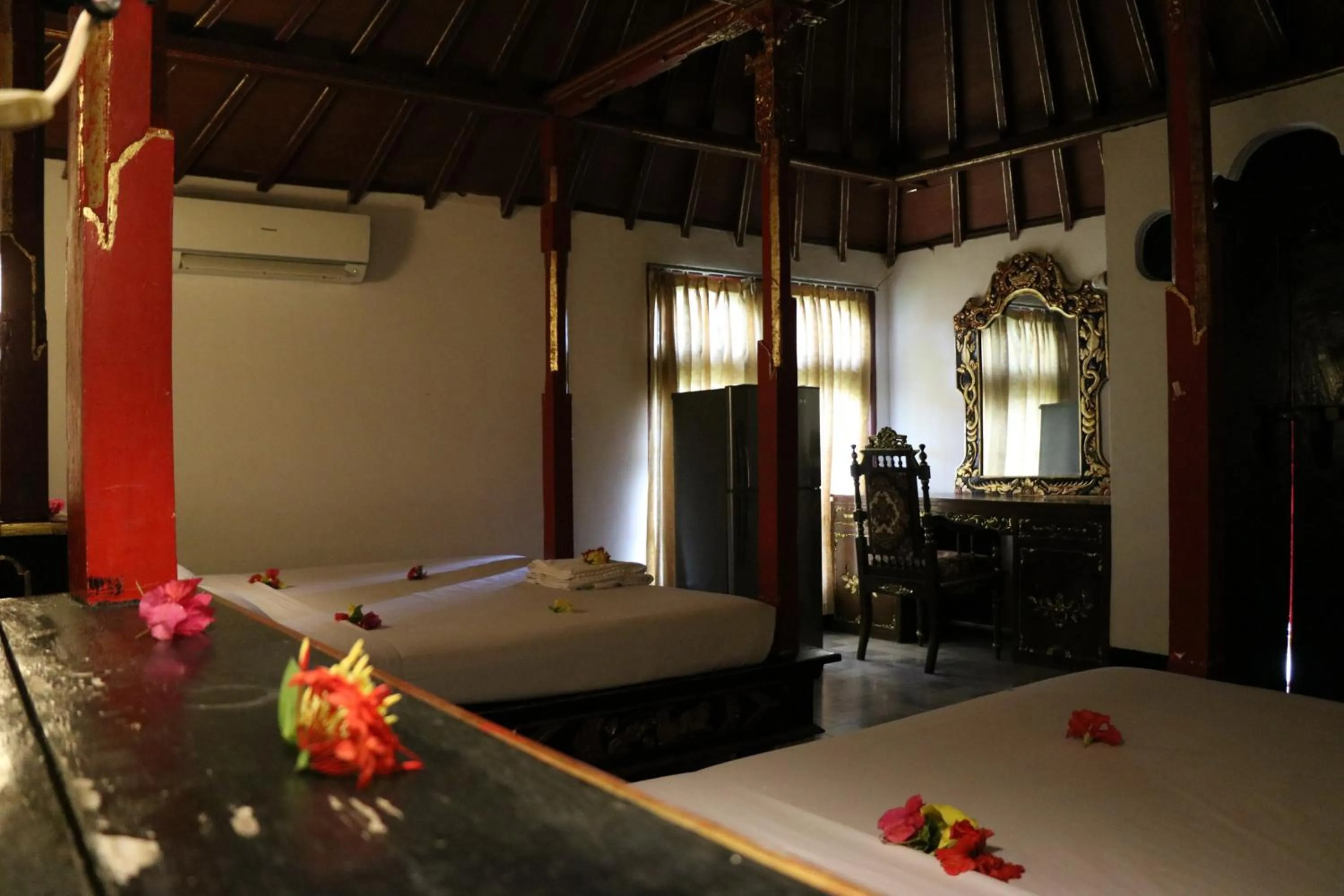 Bed in Puri Bunga Beach Cottages