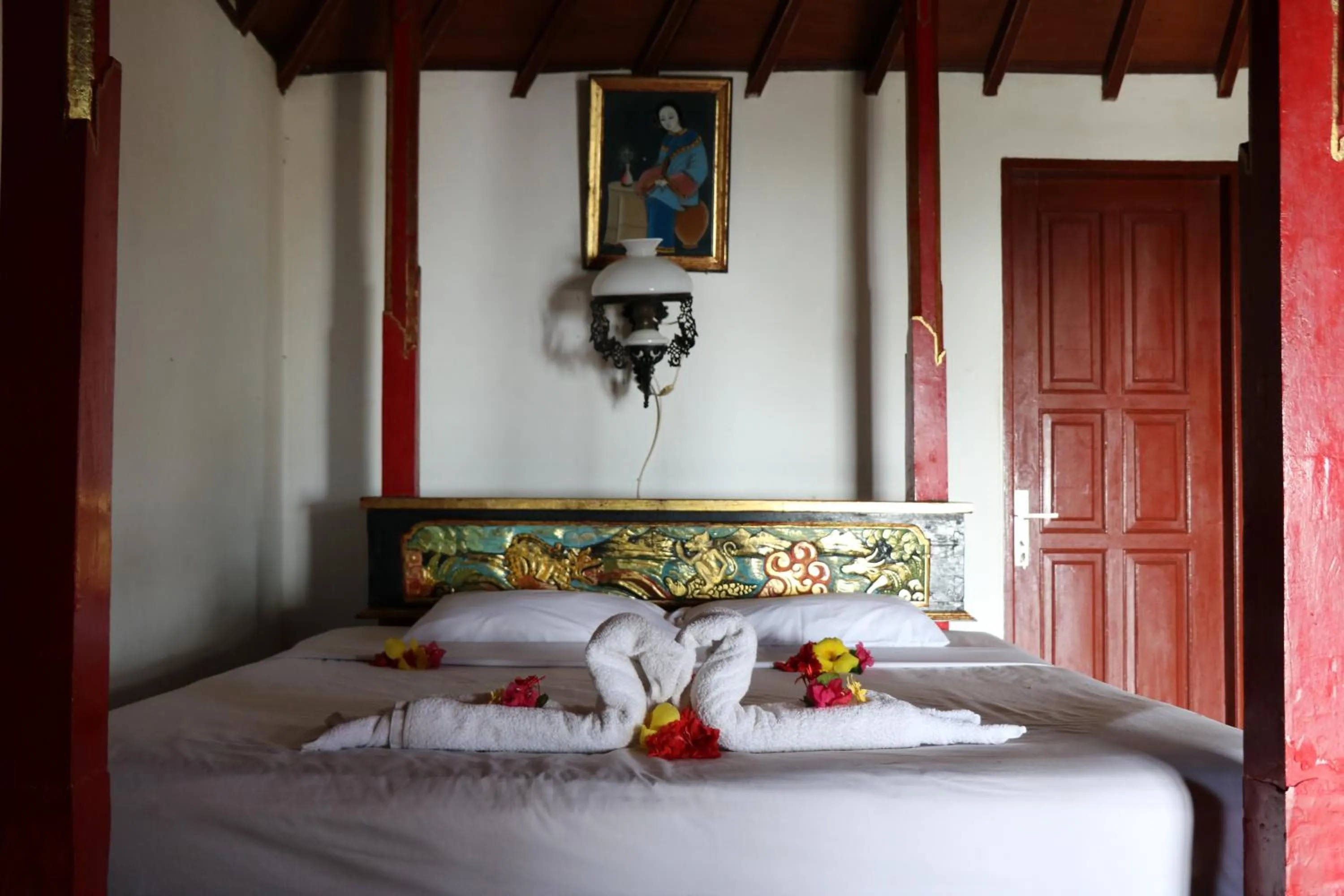 Bed in Puri Bunga Beach Cottages