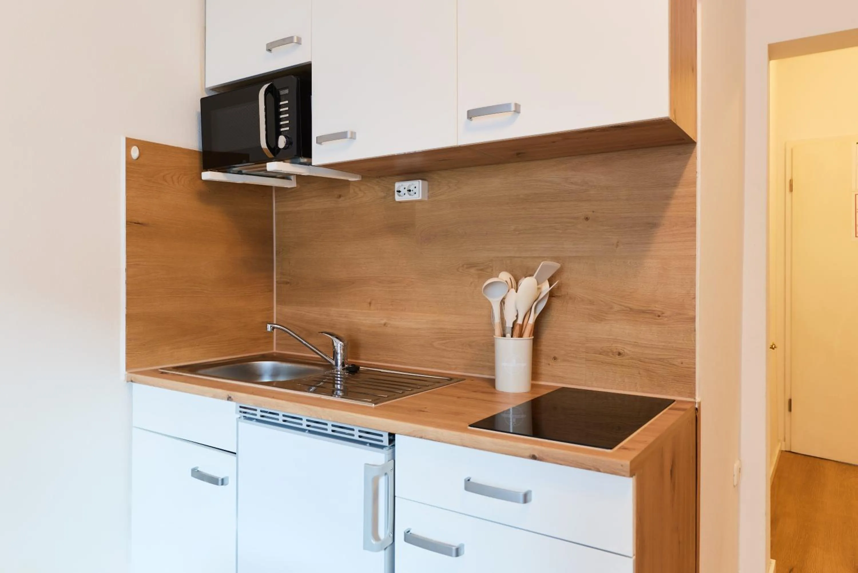 Kitchen or kitchenette in arador CITY Hotel