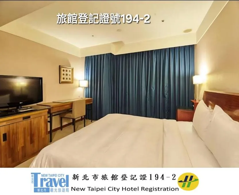 Bed in Family Hotel Taipei