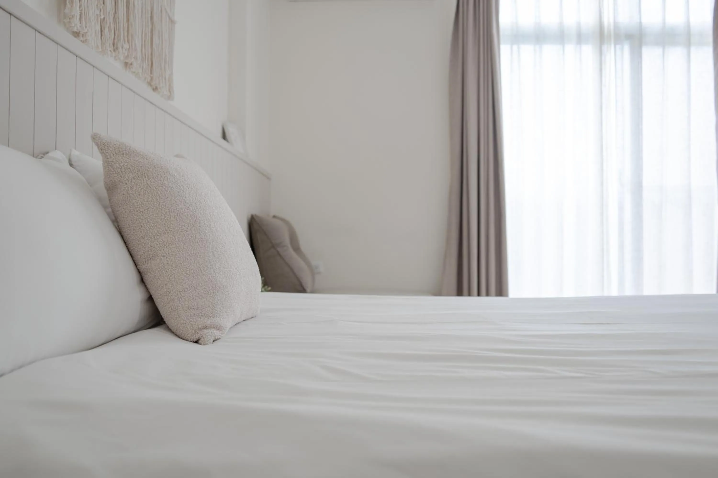 Bed in Cozy Green Guesthouse