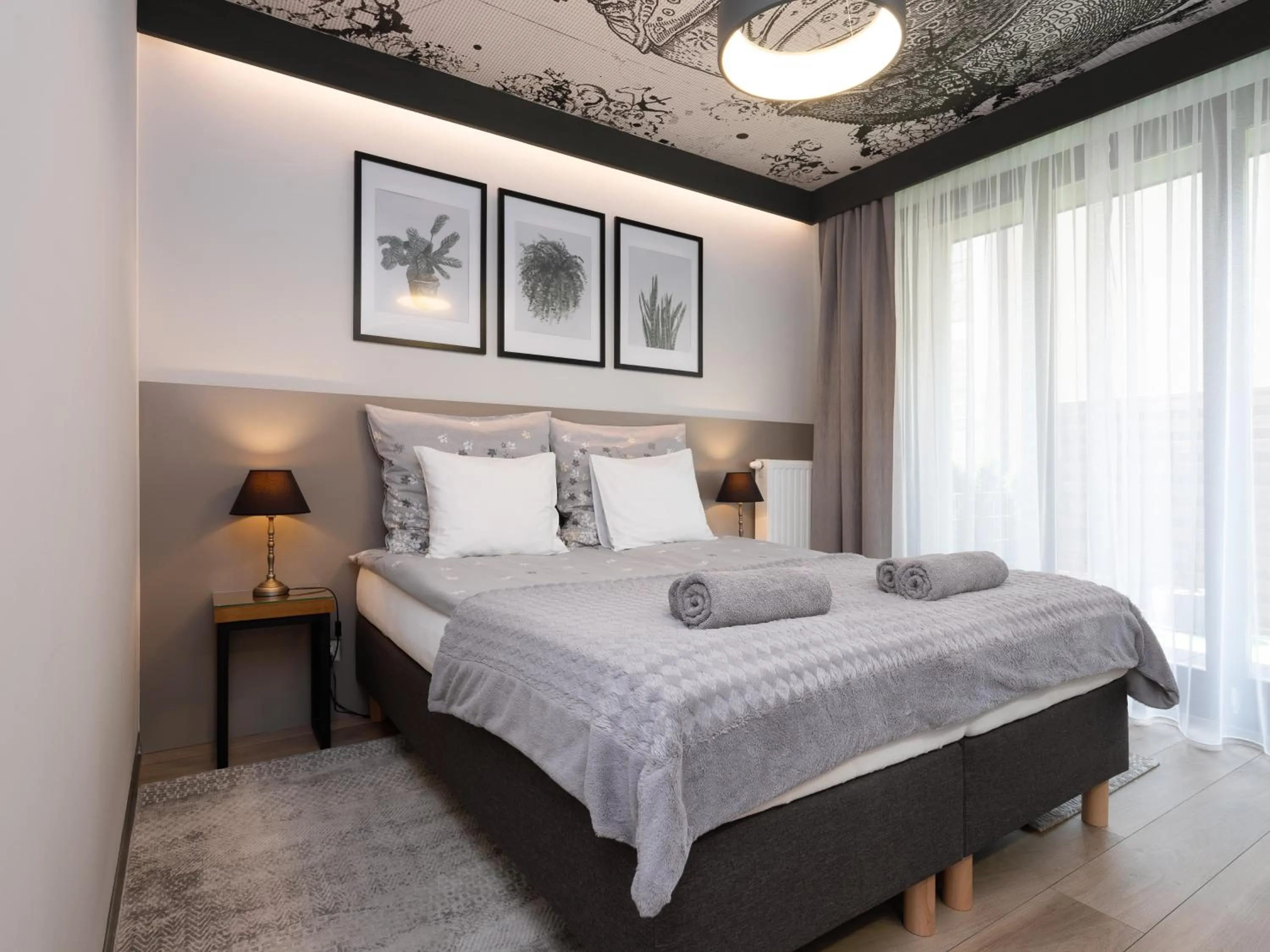 Bed in Jacuzzi Apartments