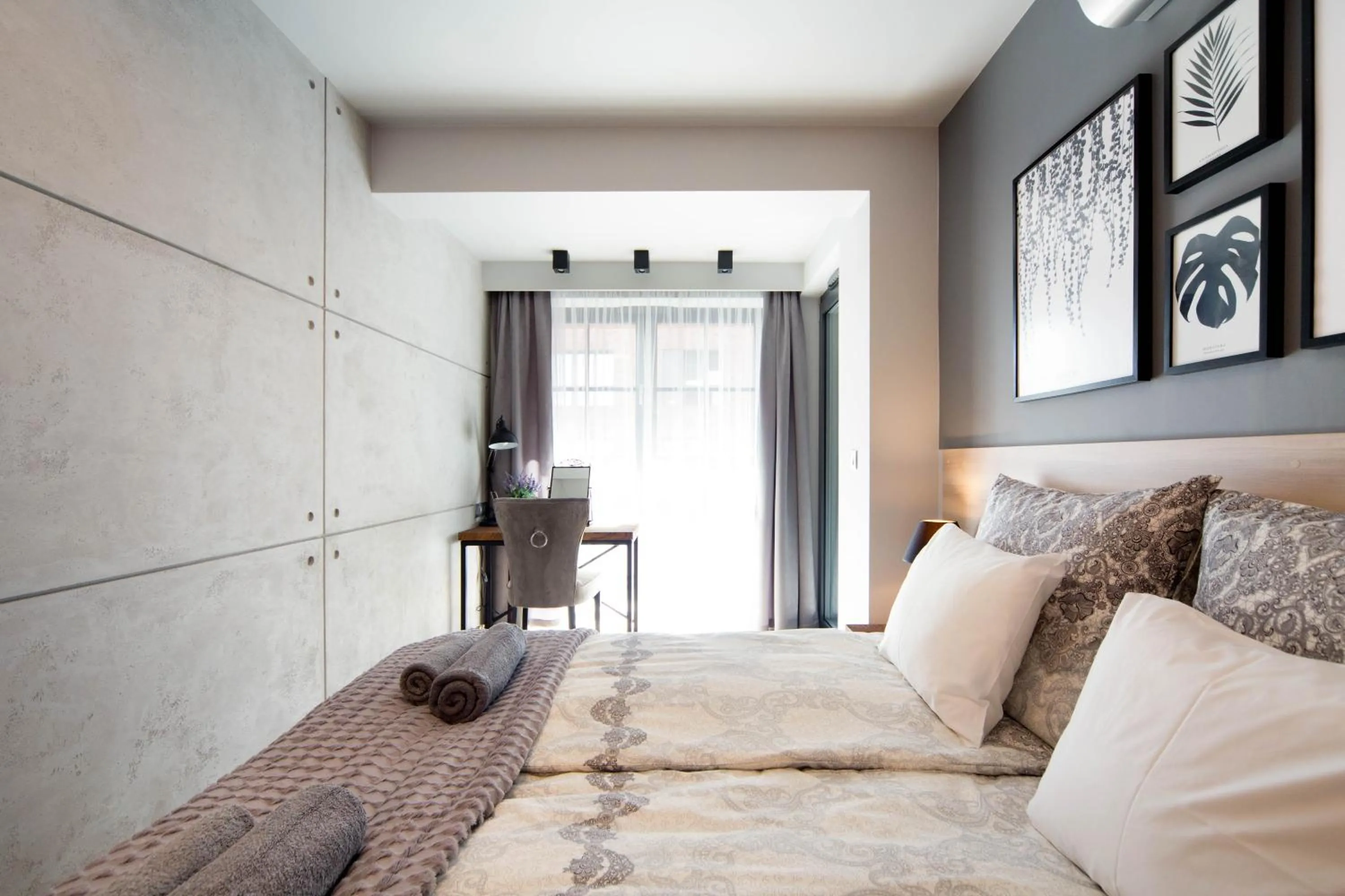 Bed in Jacuzzi Apartments