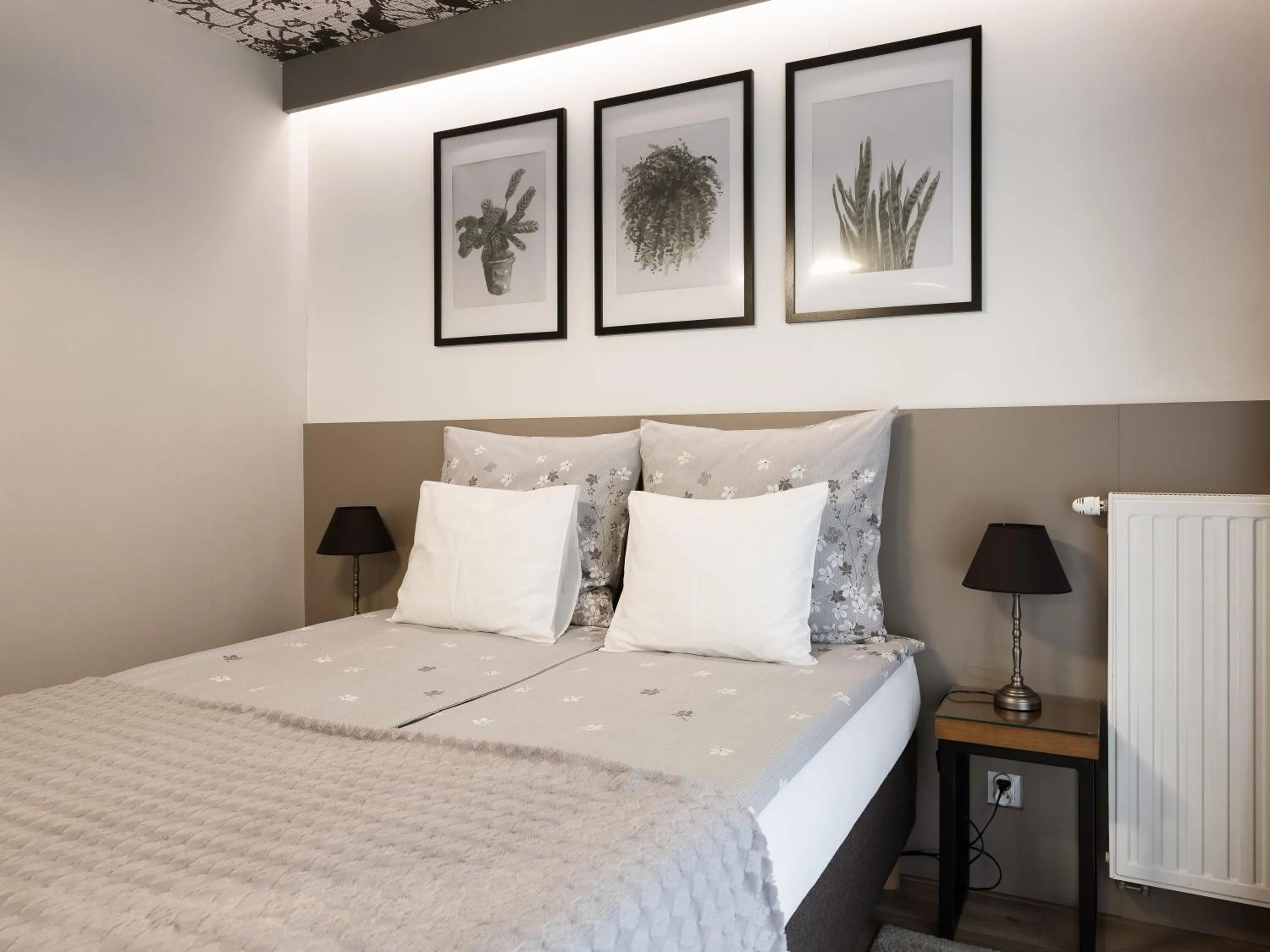 Bed in Jacuzzi Apartments
