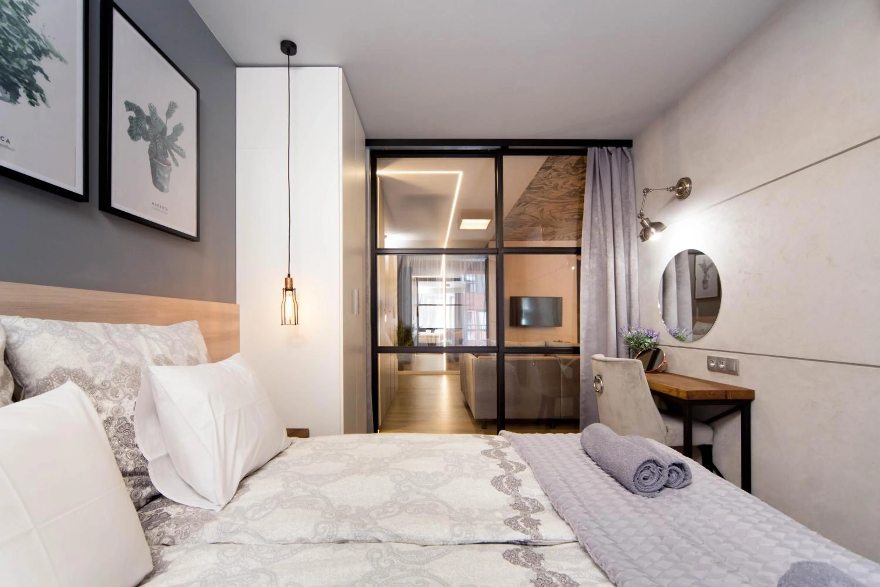 Bed in Jacuzzi Apartments