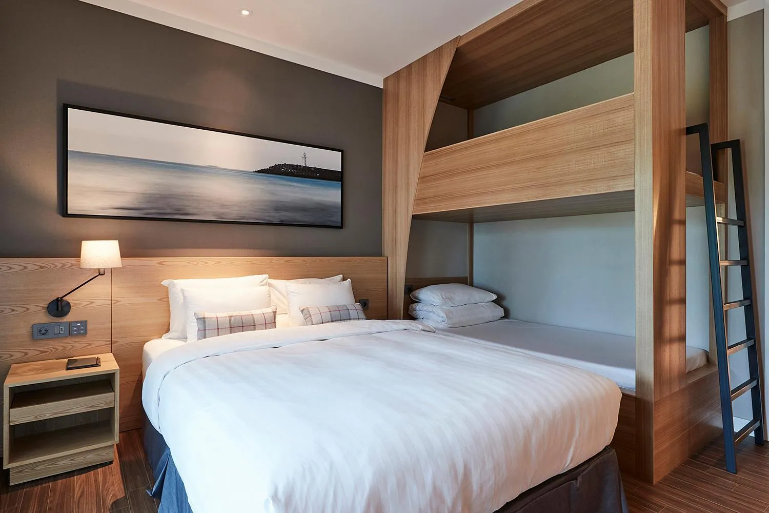 Bed in The Suites Hotel Jeju