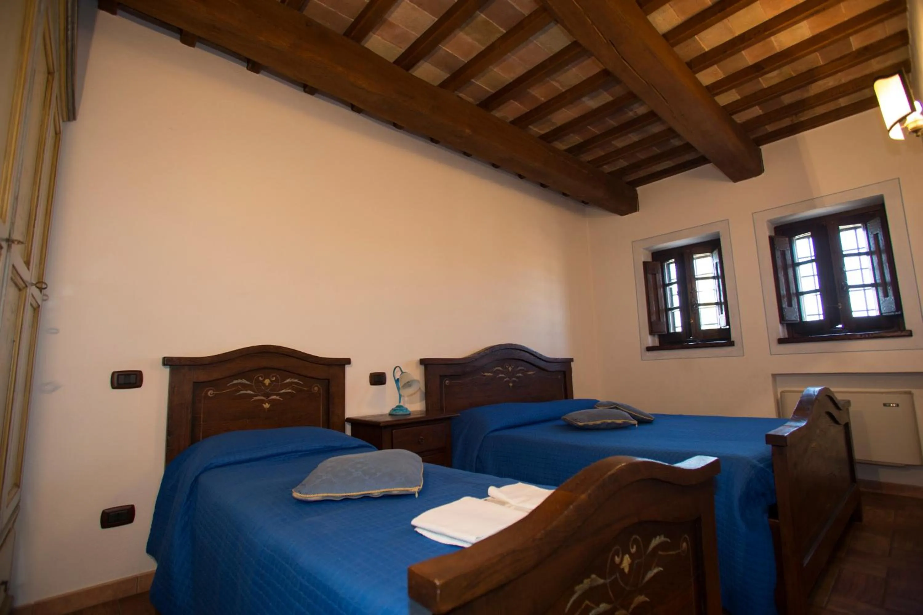 Bed in Terre Del Cantico Country House