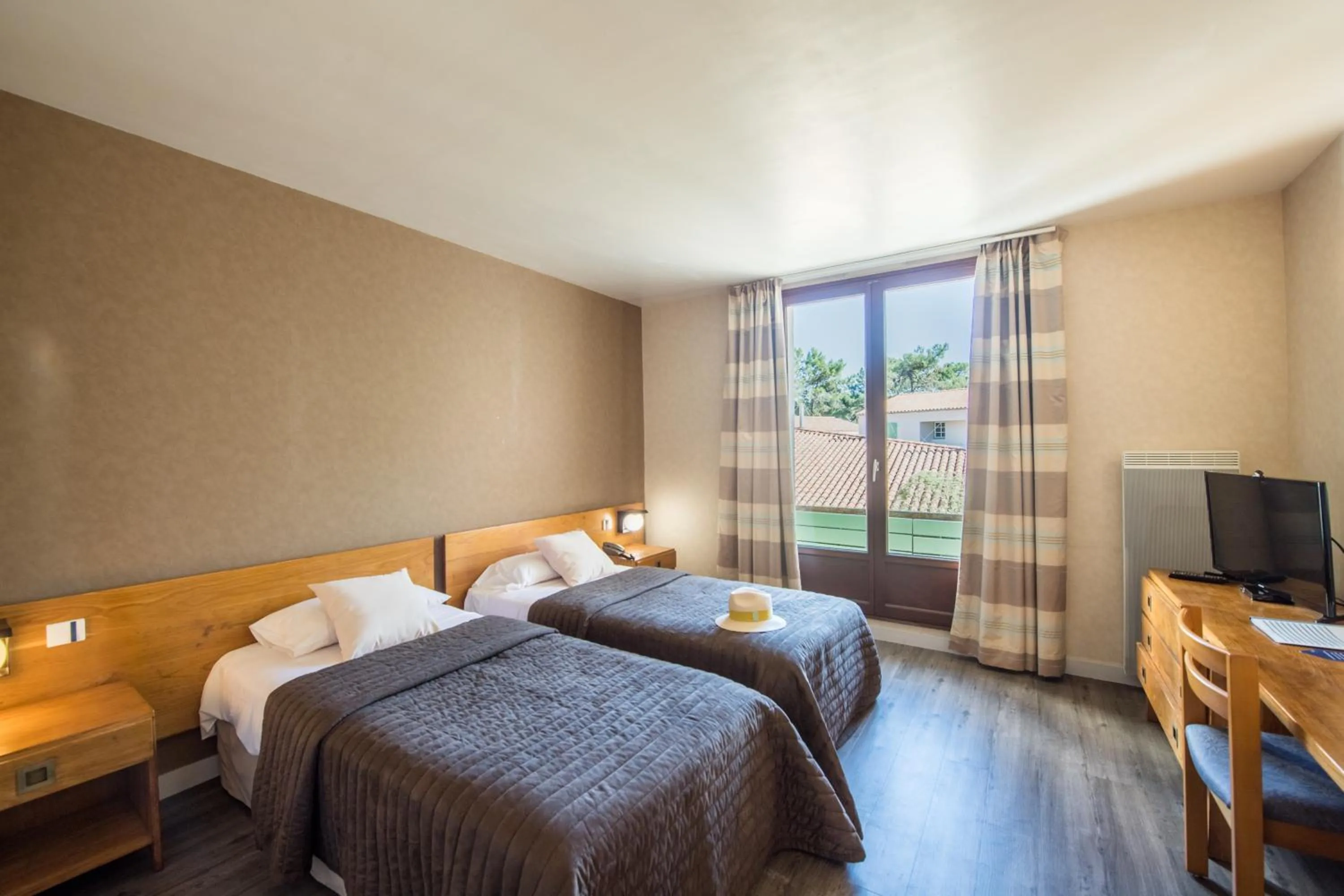 Bed in Hôtel Les Grenettes