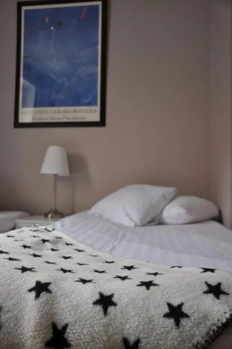 Bed in Strand Hotell