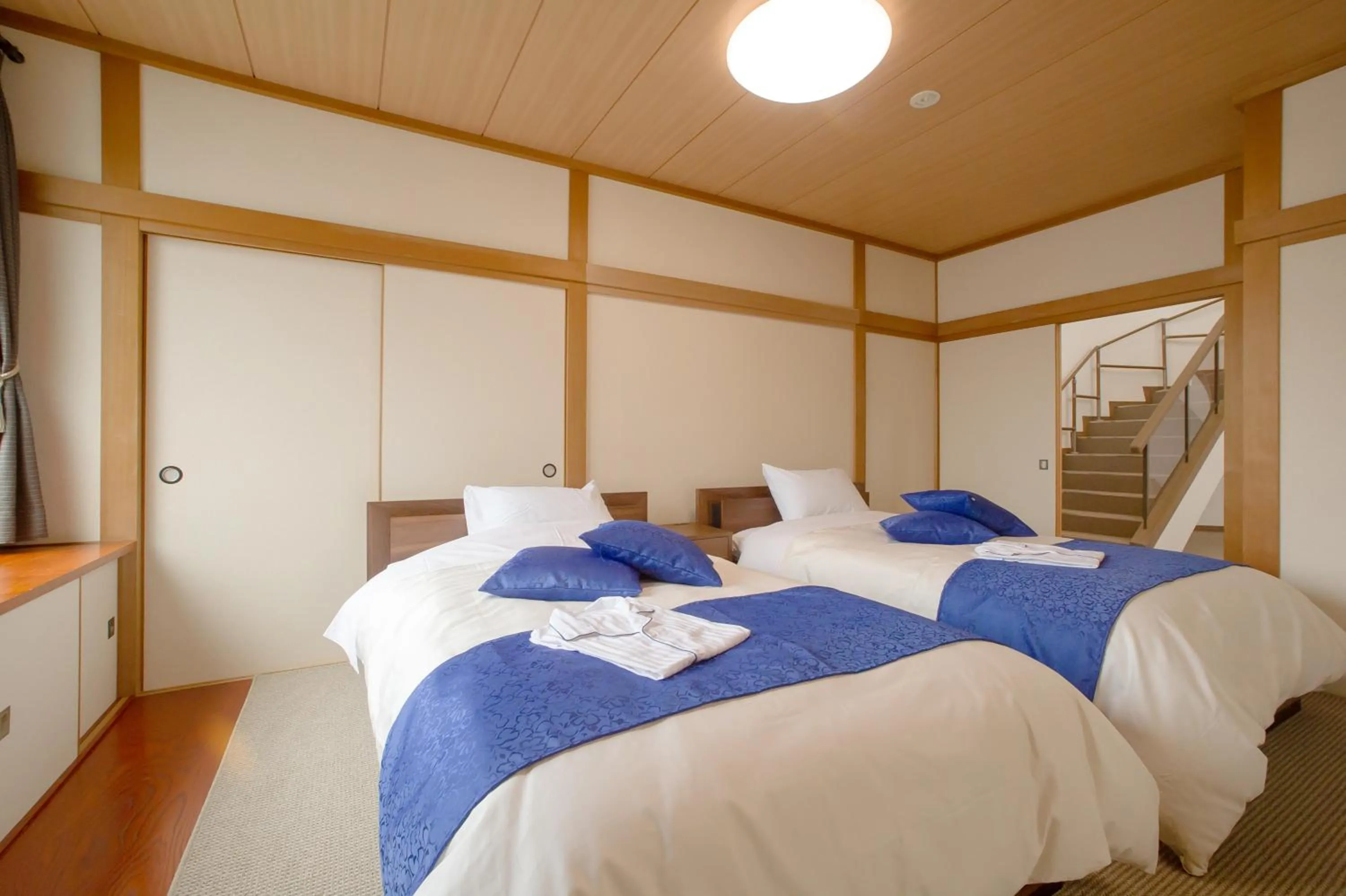 Photo of the whole room, Bed in Condominium Panoramique Motomachi