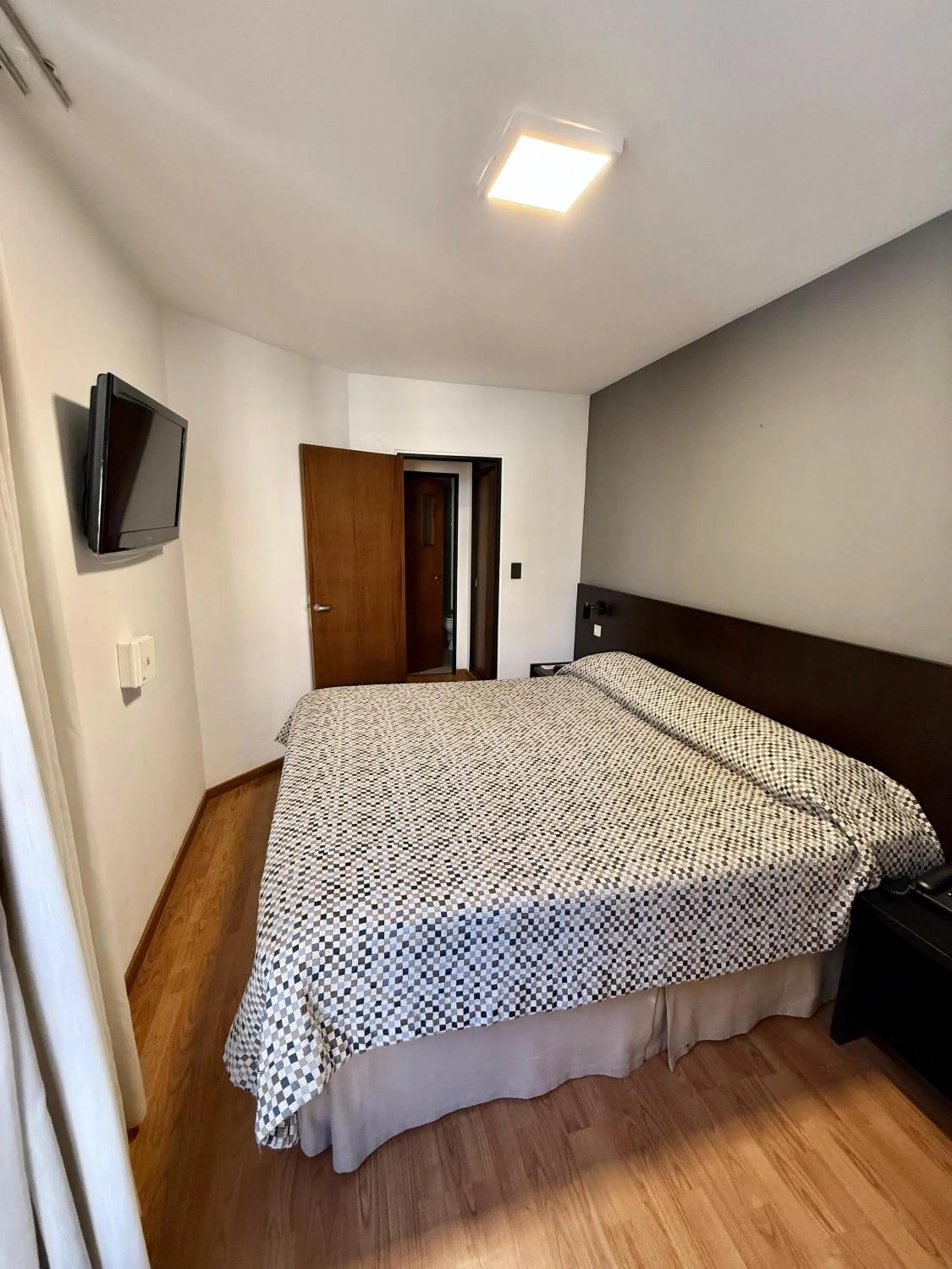 Bed in Urquiza Apart Hotel & Suites