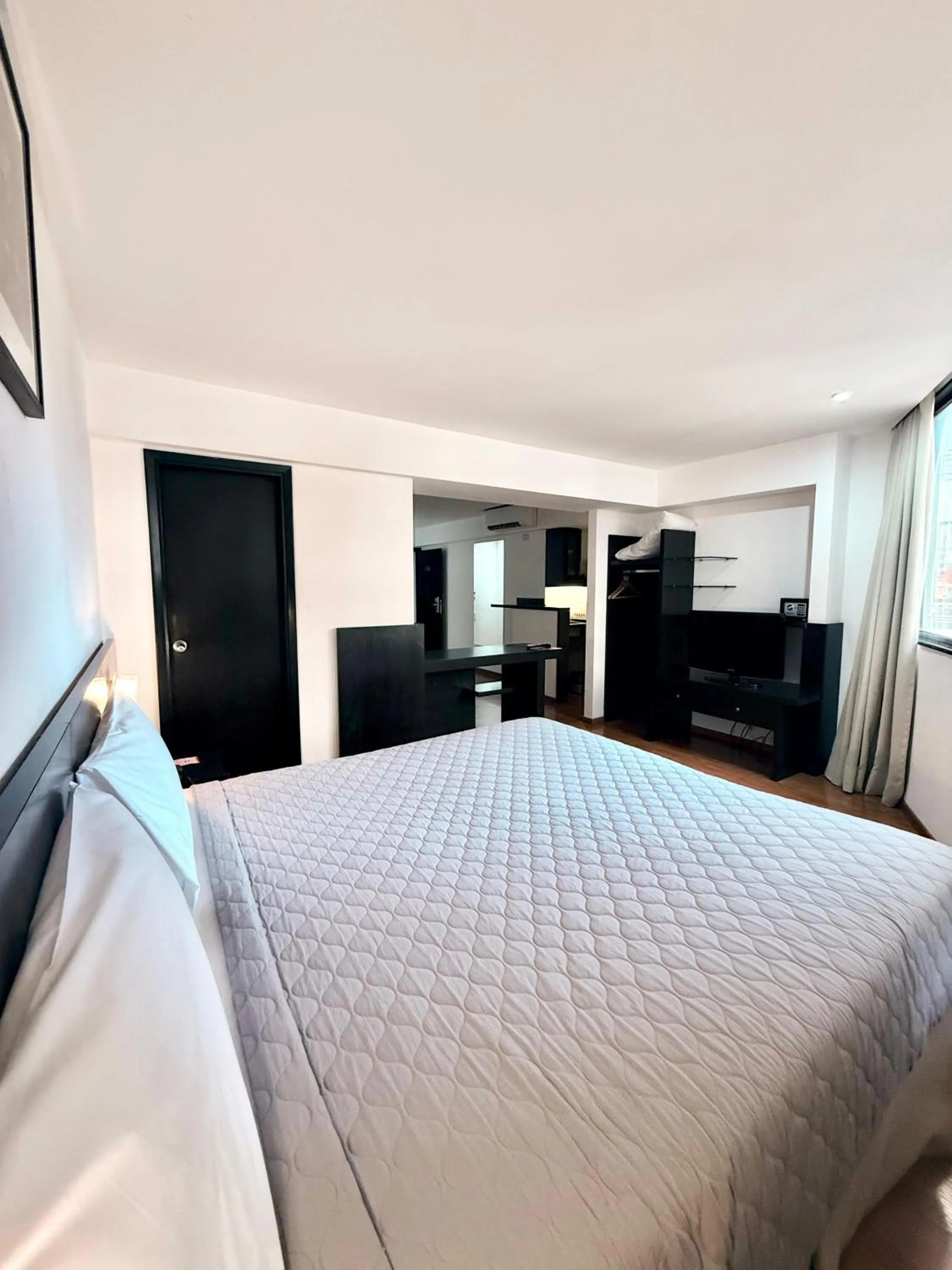 Bed in Urquiza Apart Hotel & Suites