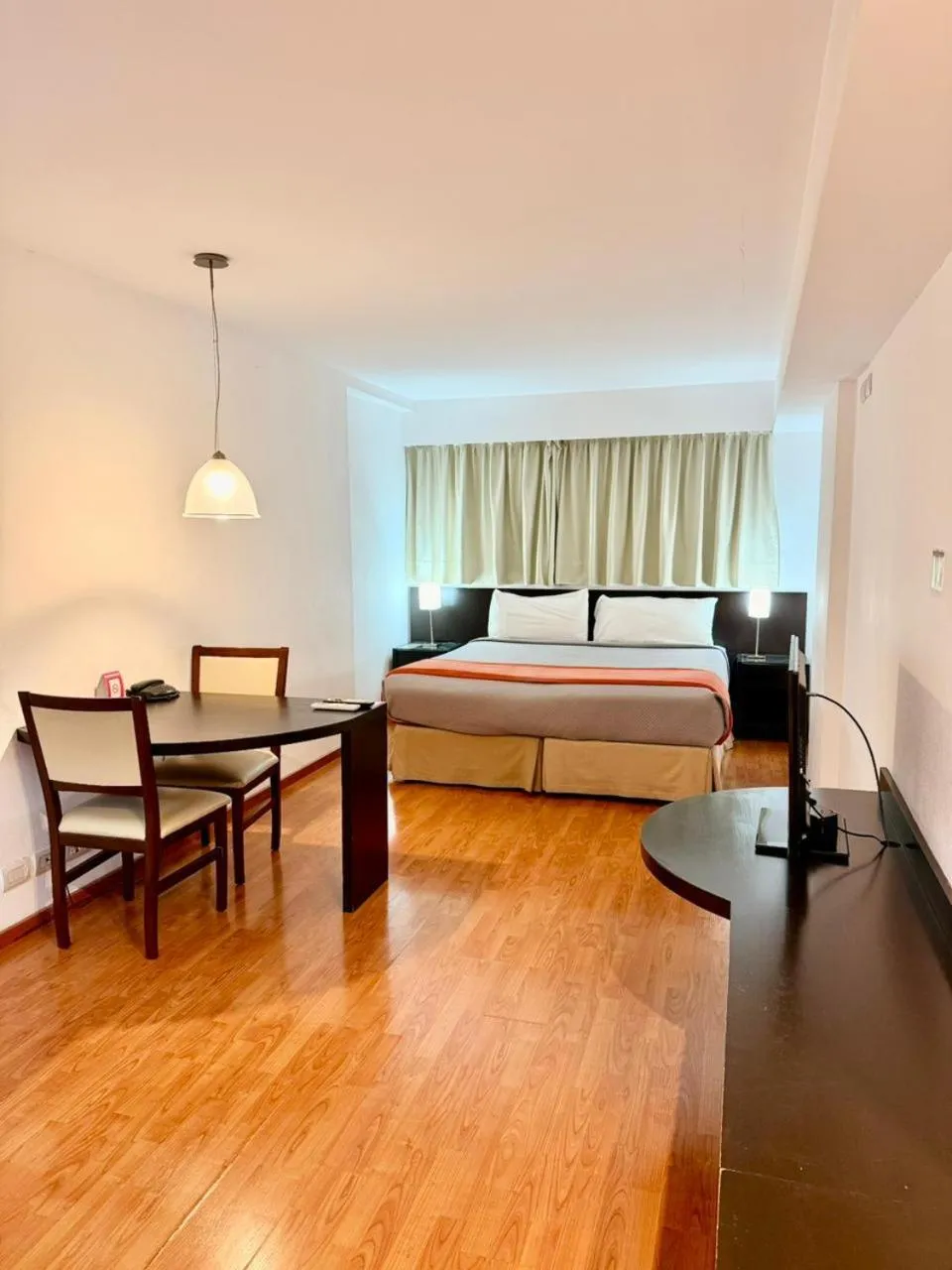 Bed in Urquiza Apart Hotel & Suites