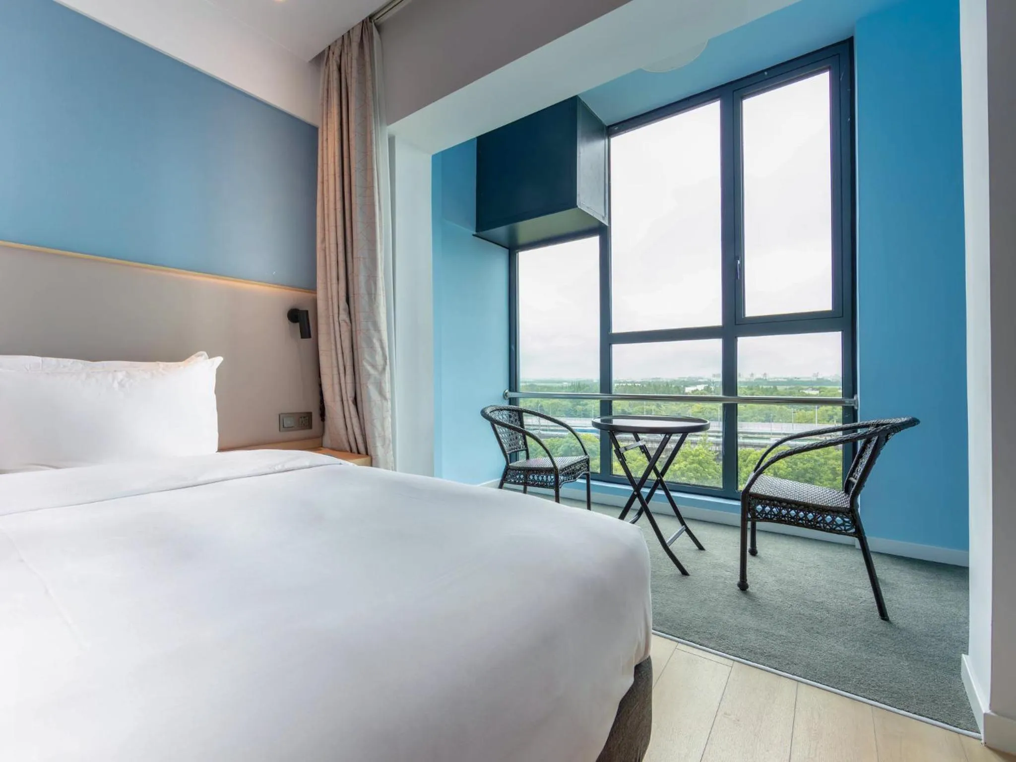 Photo of the whole room, Bed in Holiday Inn Express Shanghai Pudong Airport by IHG