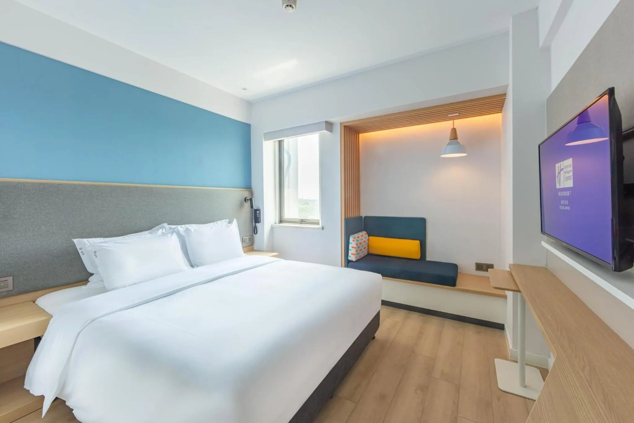 Photo of the whole room, Bed in Holiday Inn Express Shanghai Pudong Airport by IHG