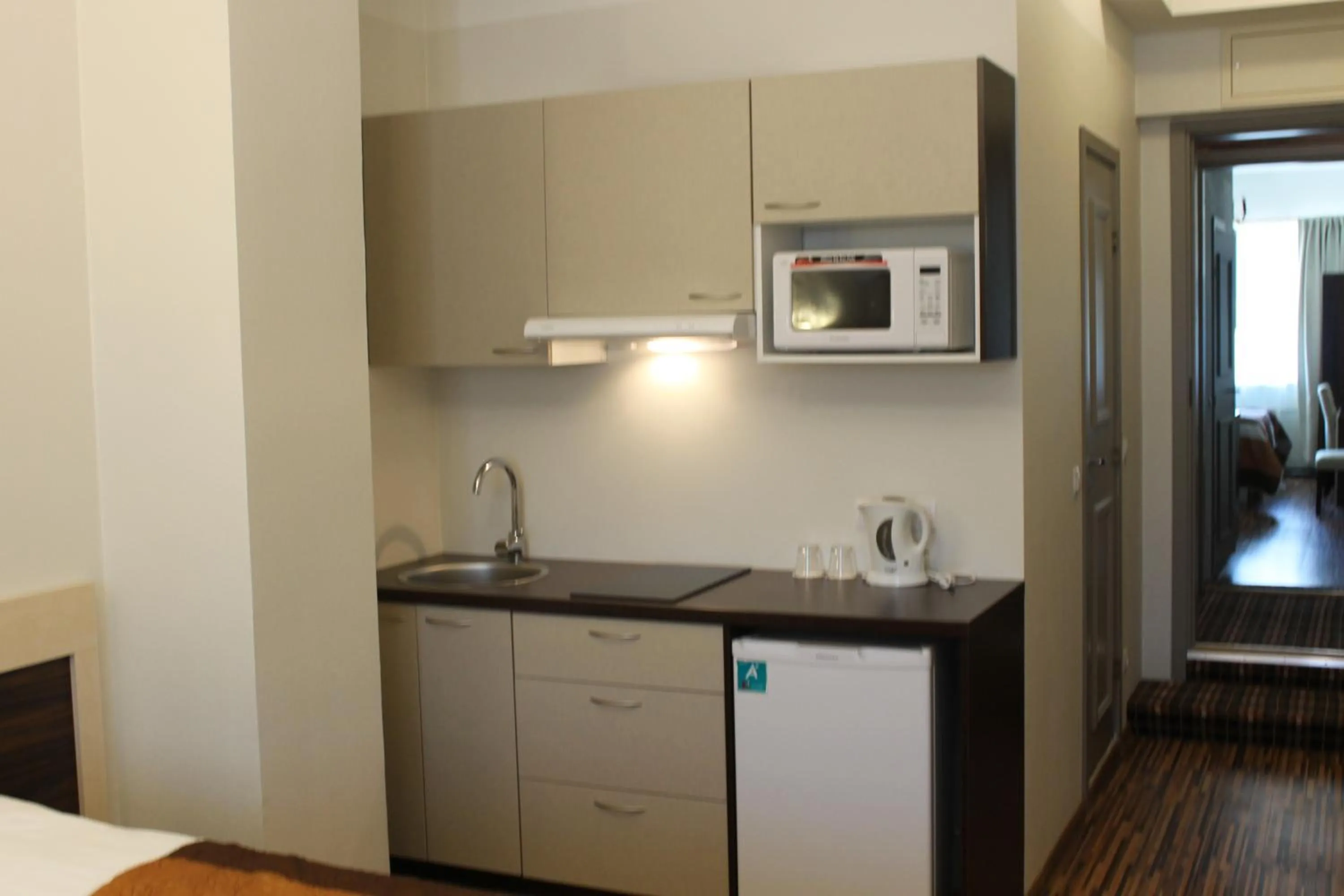 Kitchen or kitchenette in Ecoland Hotel