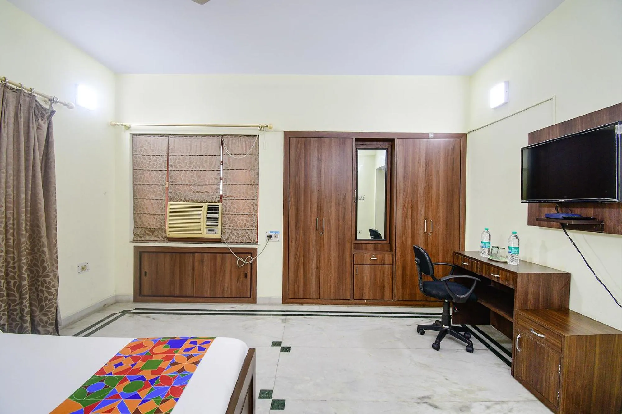 Bed in FabExpress Ullash Residency