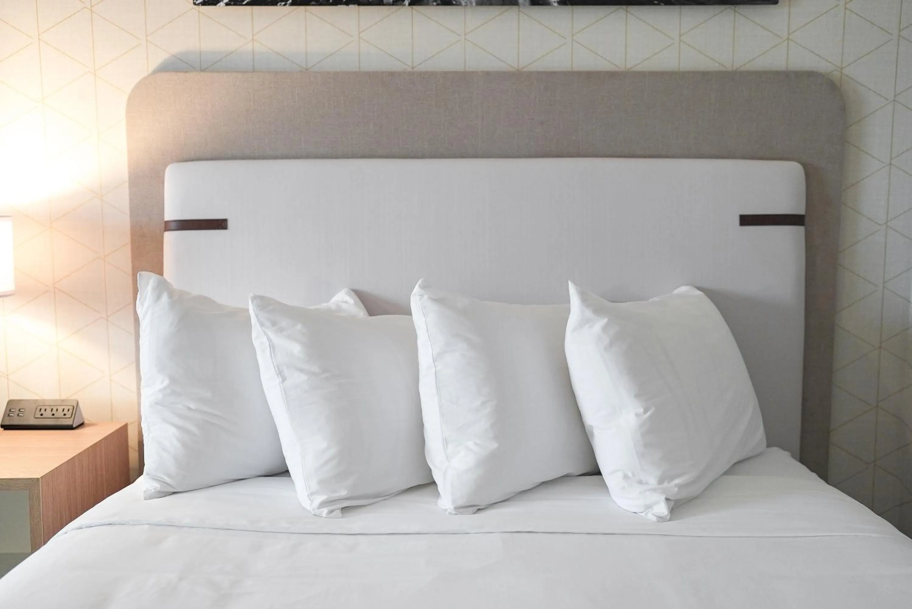 Bed in The Boulevard Hotel