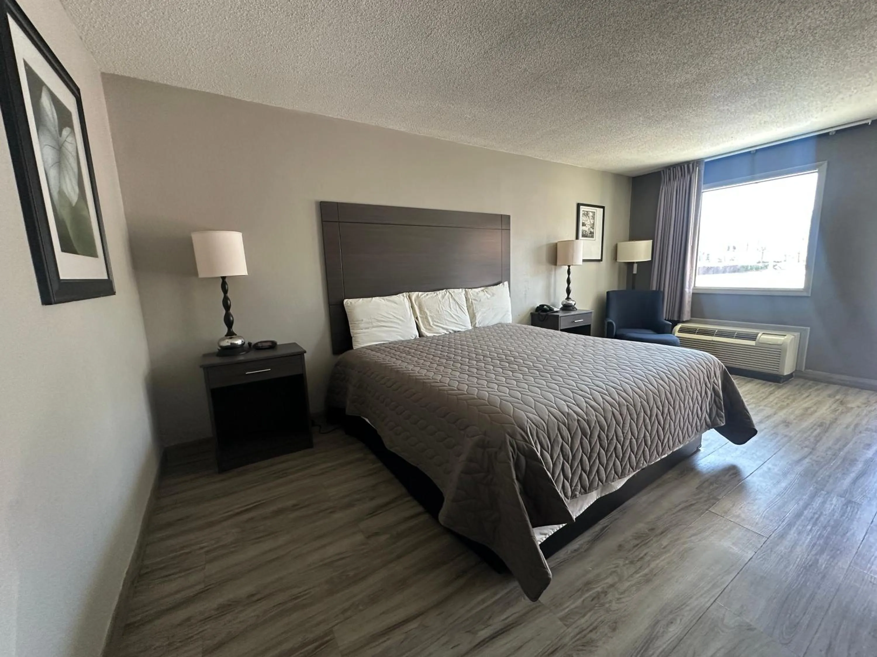 Bedroom in Executive Inn Locust Grove by Capital O