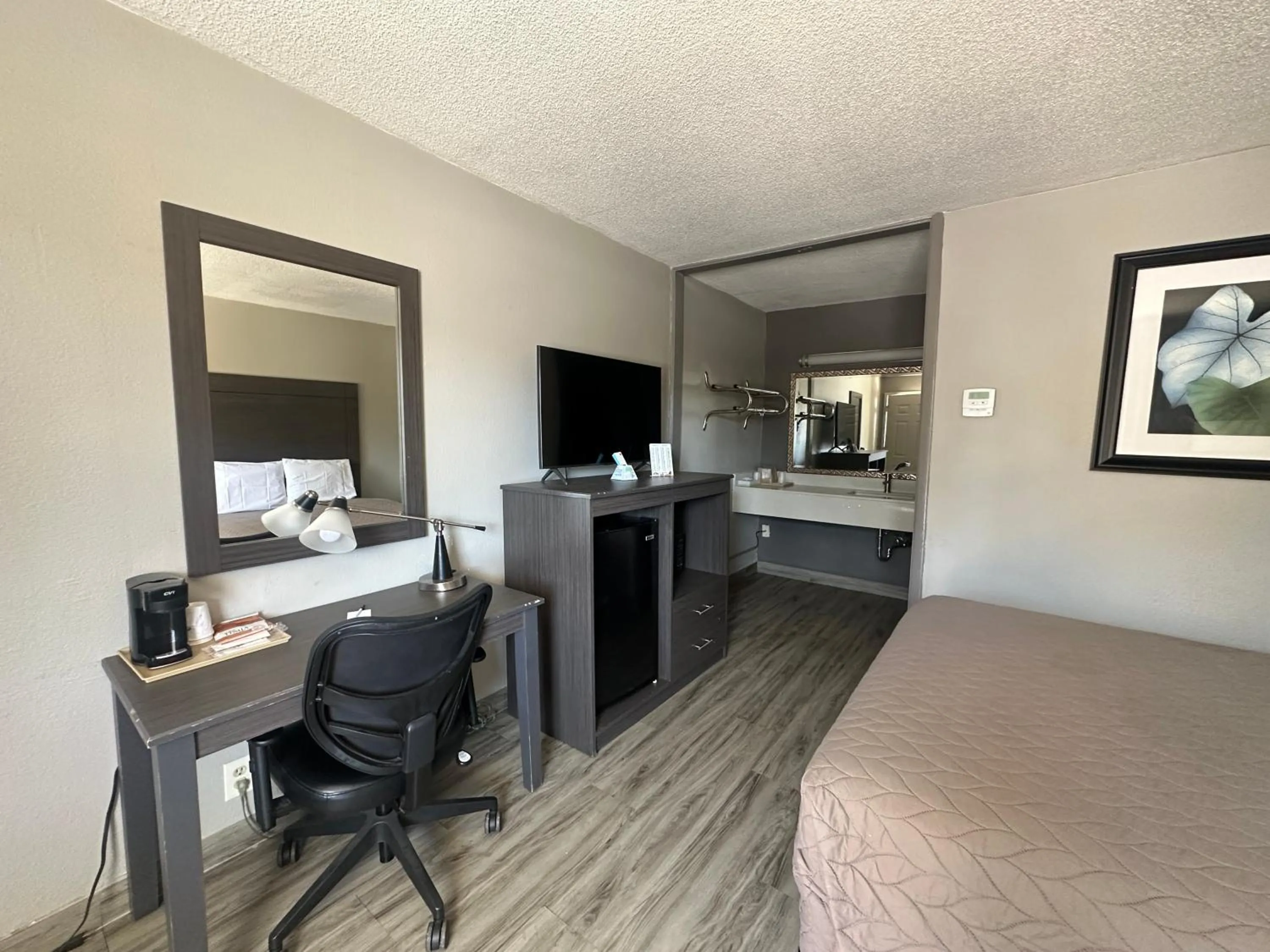 Bedroom in Executive Inn Locust Grove by Capital O