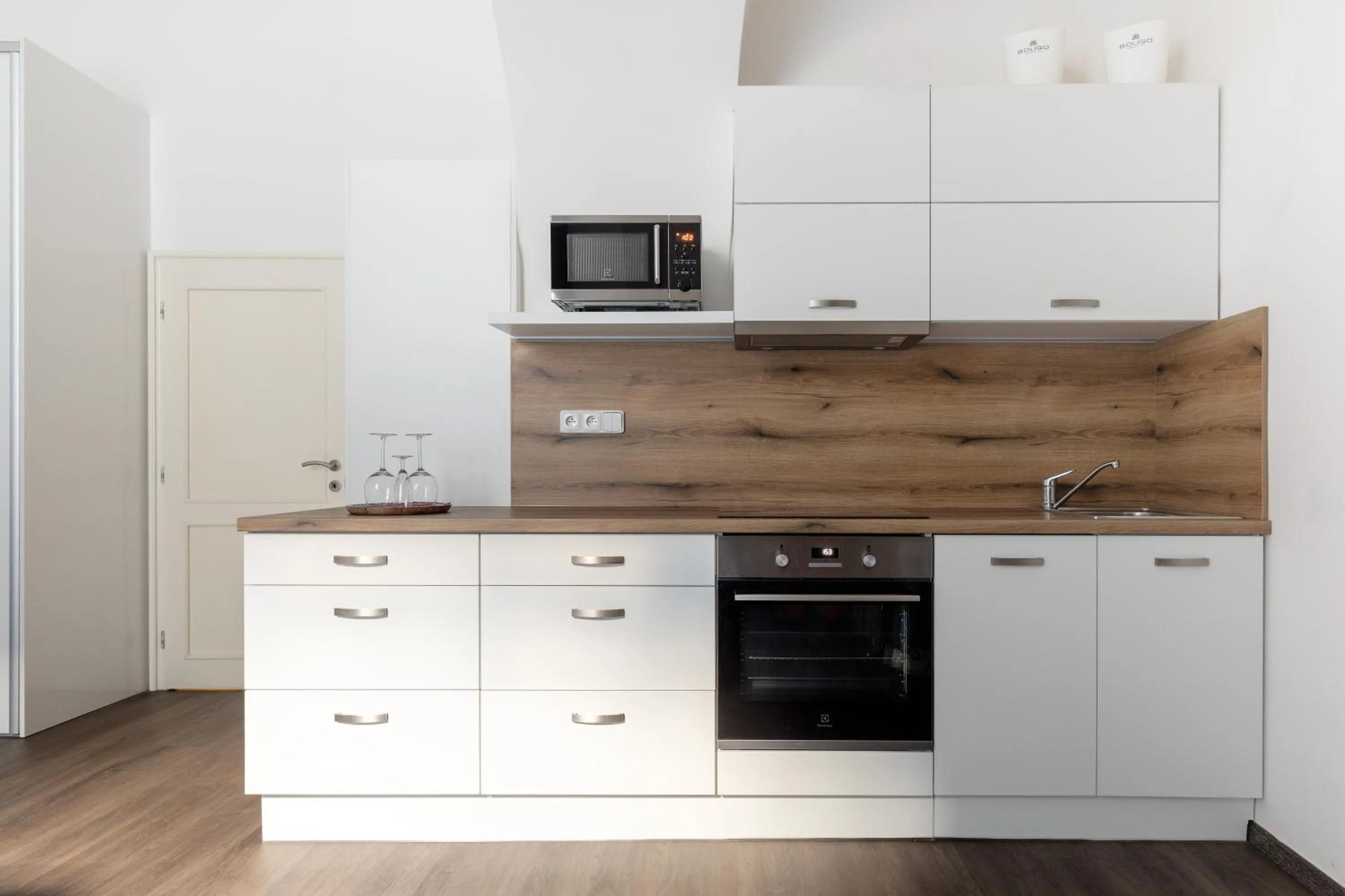 Kitchen or kitchenette in Old Town Square Residence by Emblem