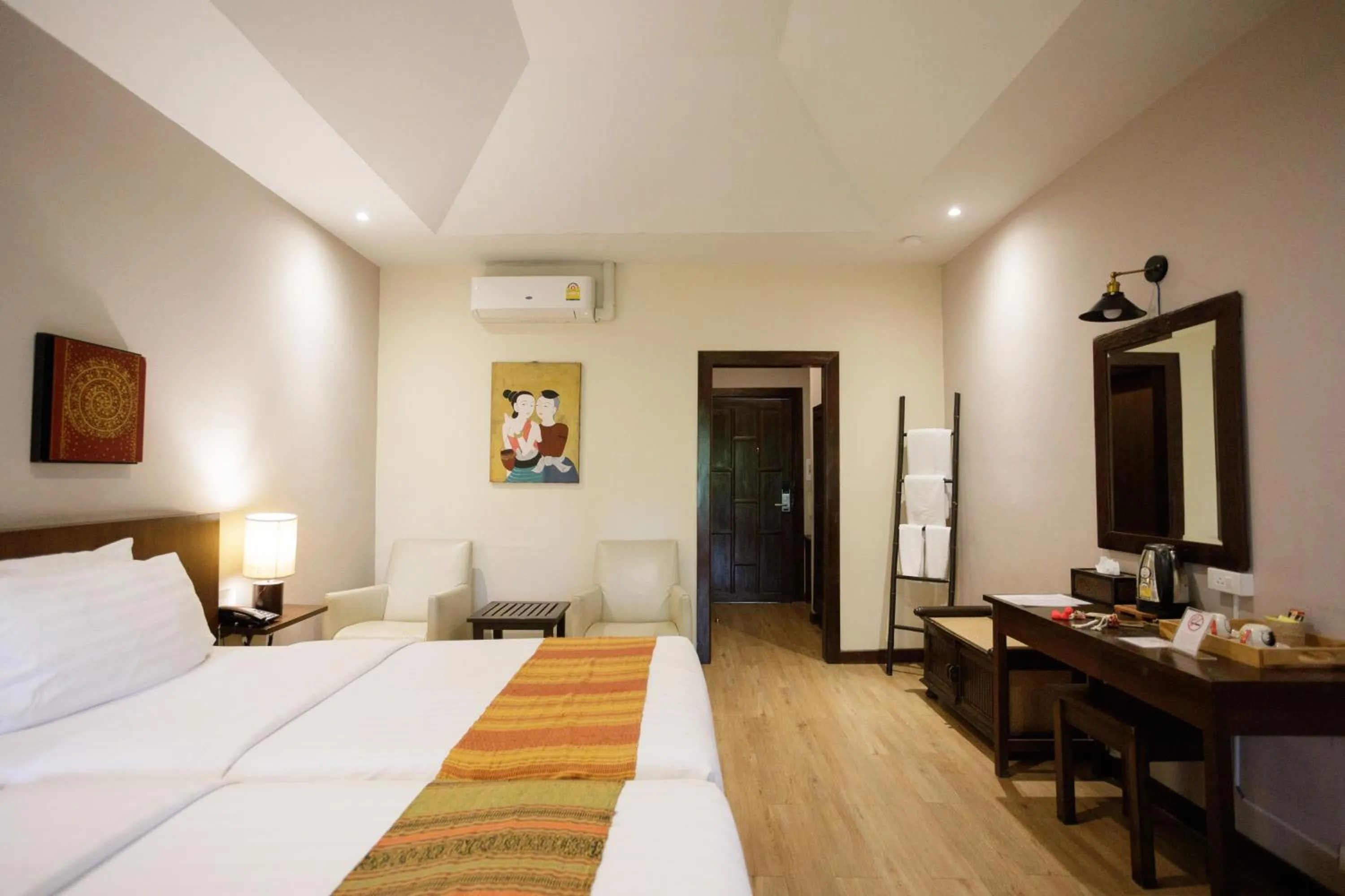 Photo of the whole room, Bed in Lanna Dusita Riverside Boutique Resort