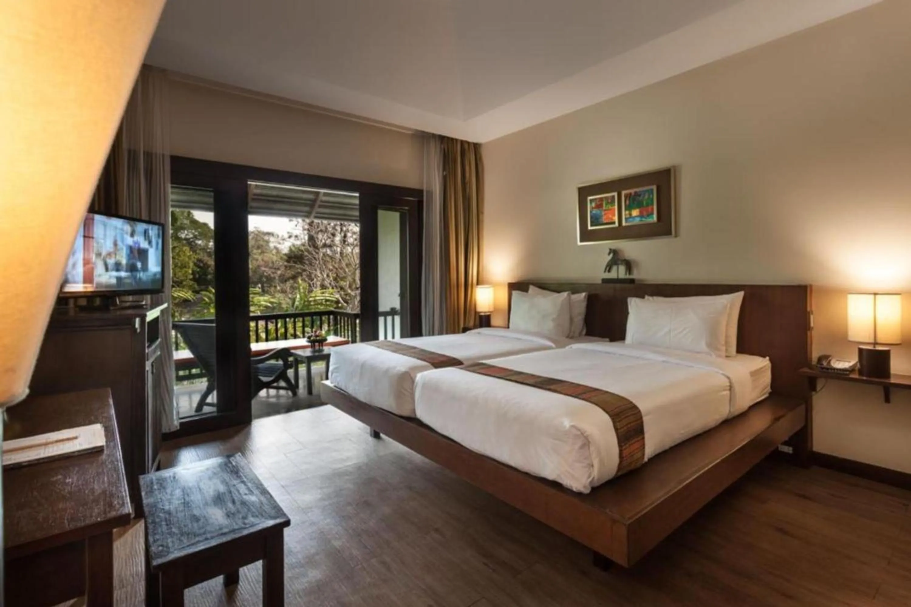 Bed in Lanna Dusita Riverside Boutique Resort