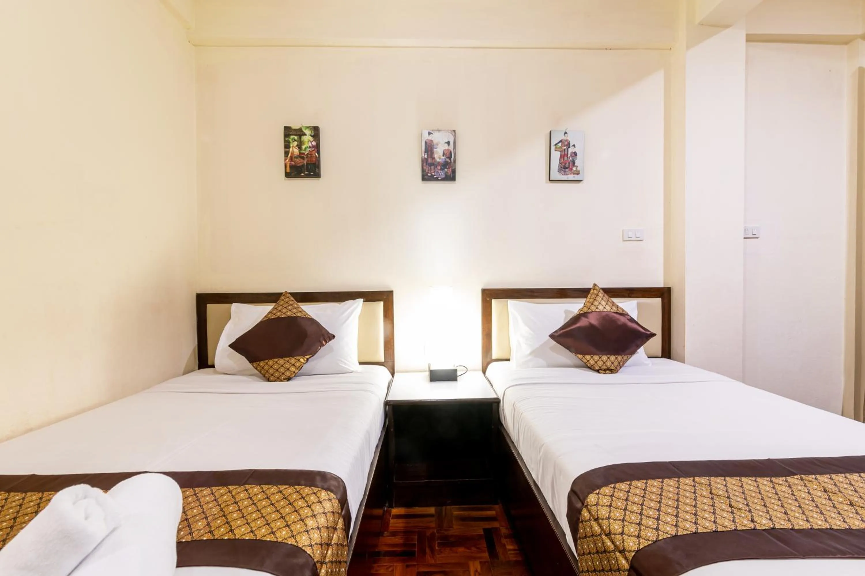 Bed in The Palm Garden Hotel