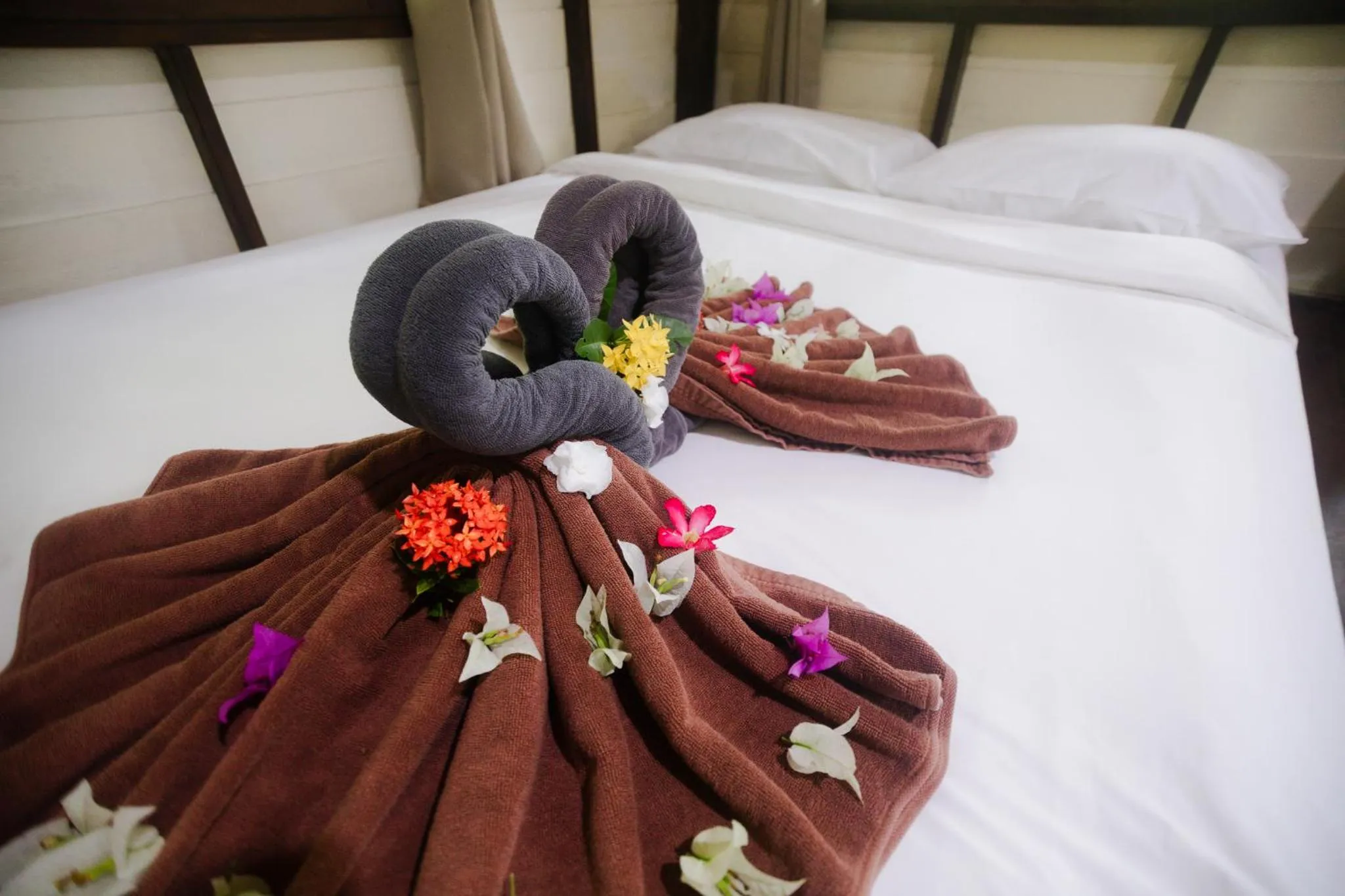 Bed in The Vatika Resort and Spa