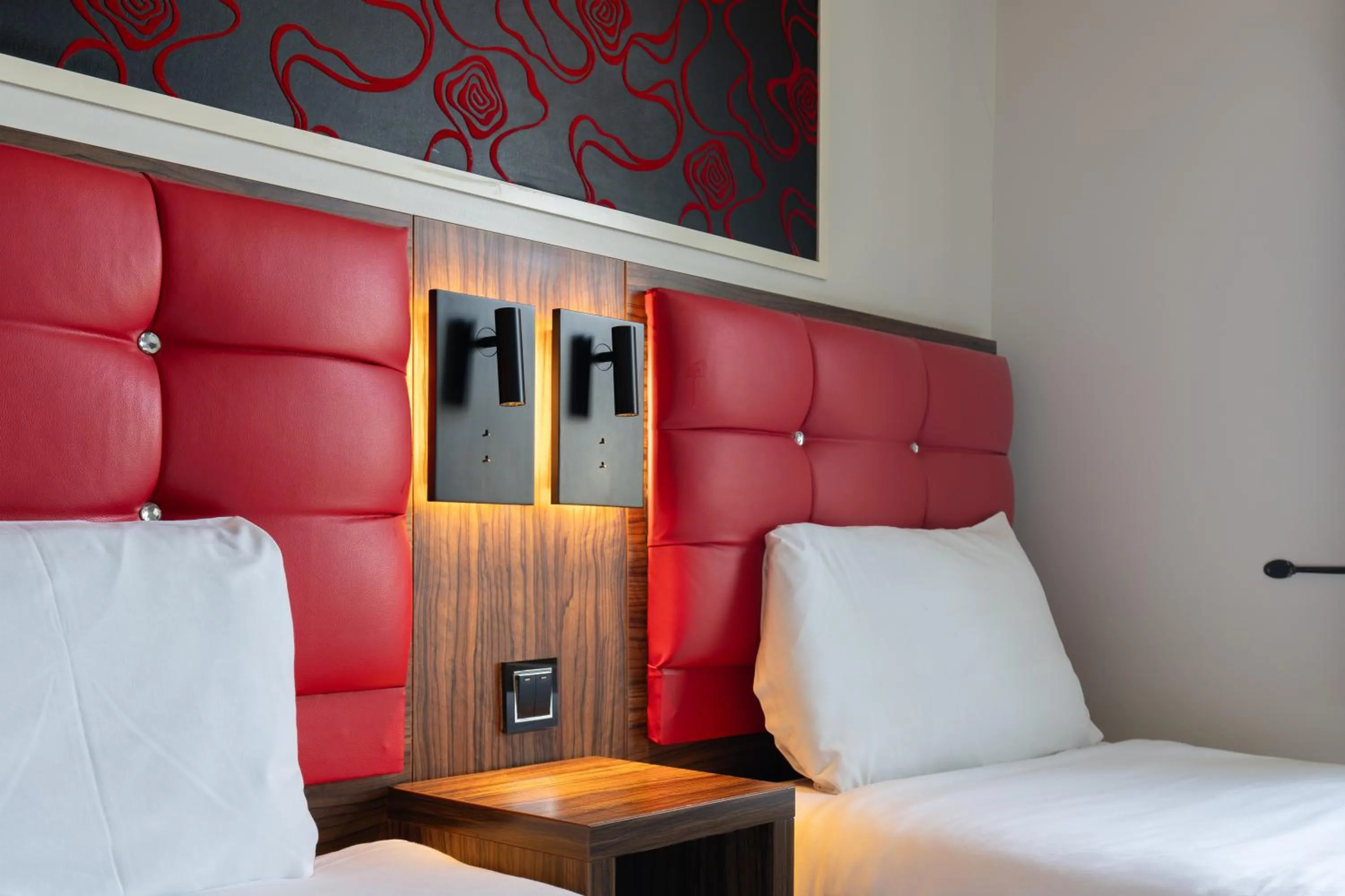 Bed in Simply Rooms & Suites
