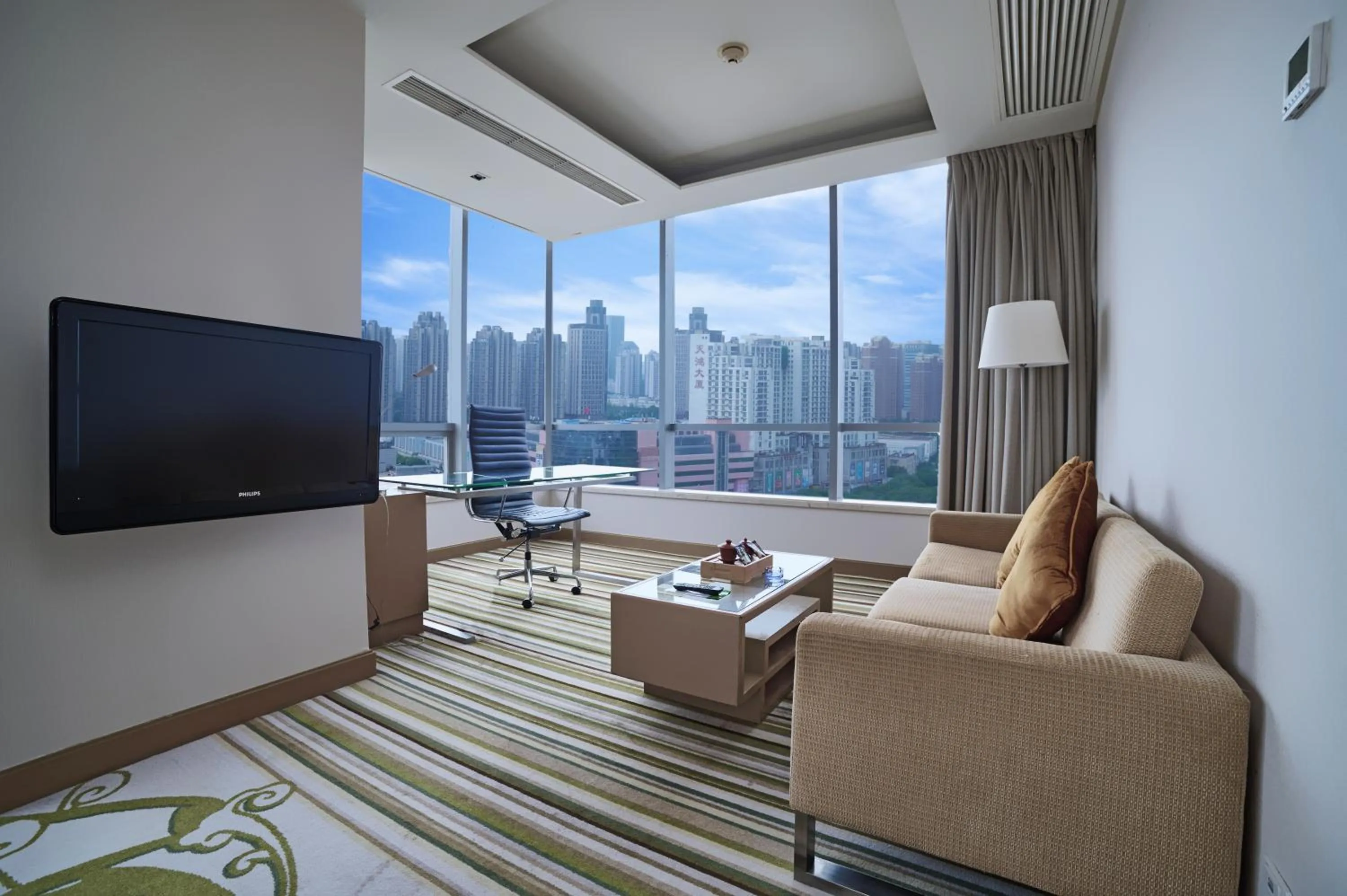 Living room in Holiday Inn Tianjin Riverside by IHG