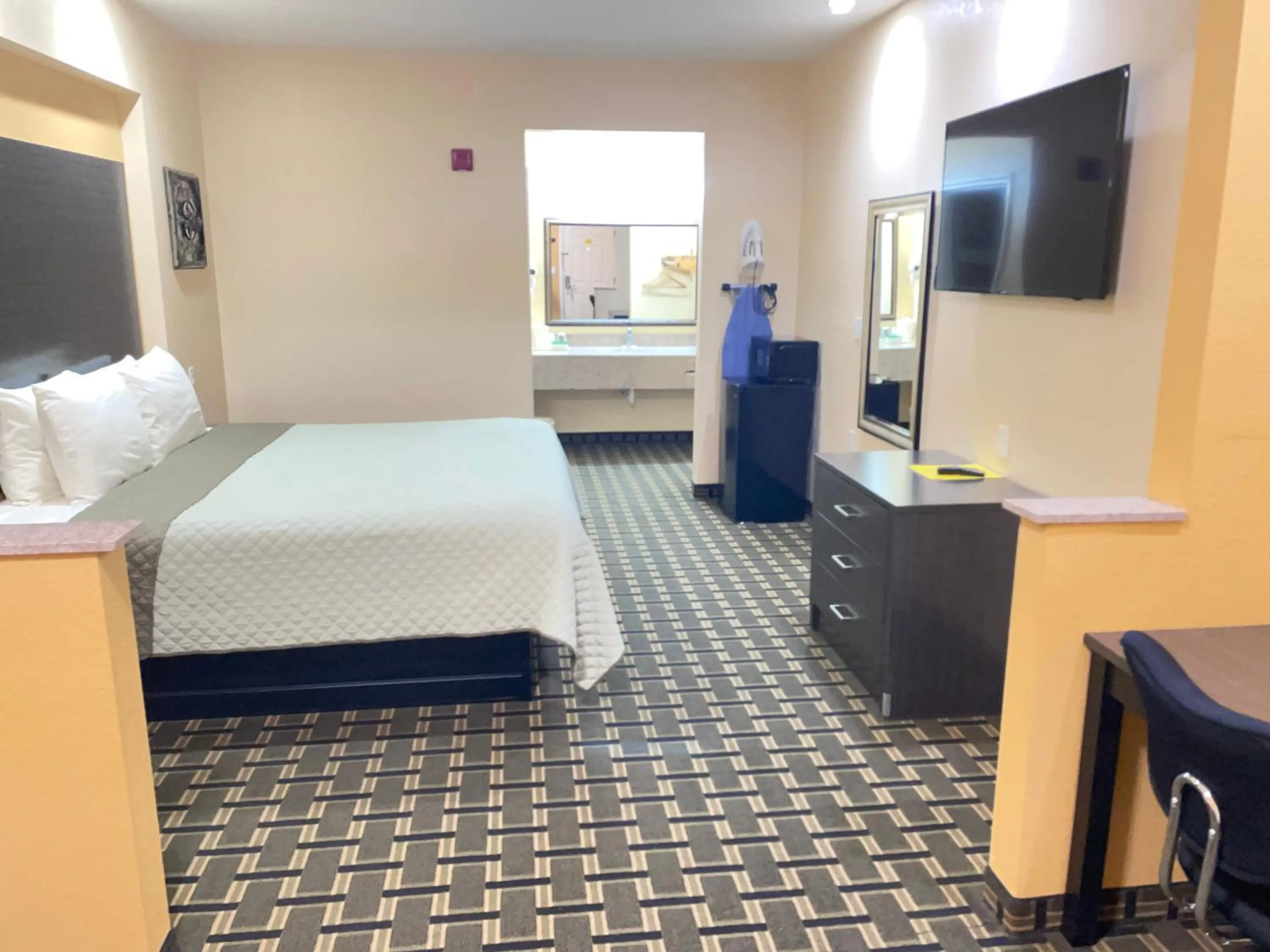 Bed in Homegate Inn & Suites West Memphis