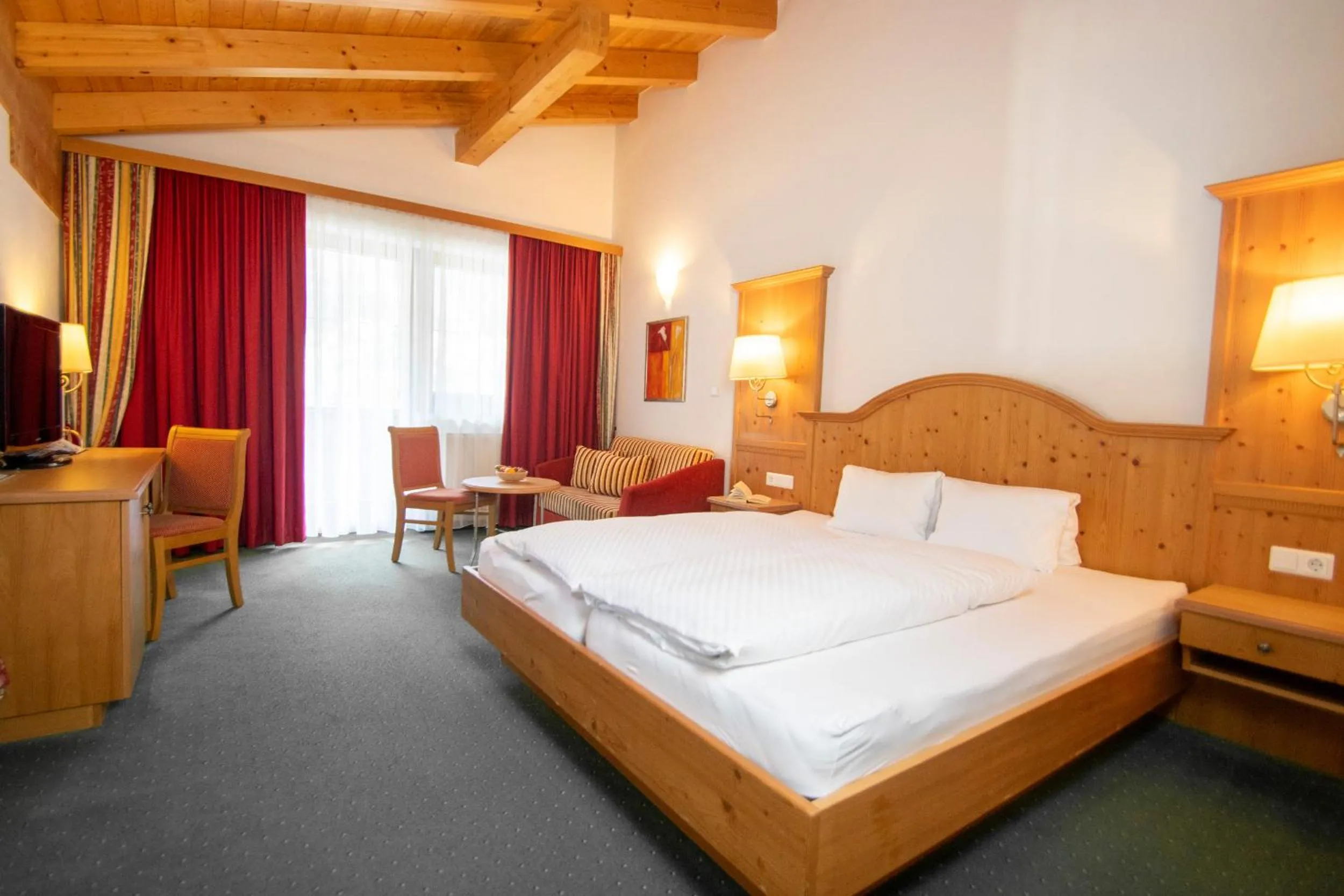 Seating area, Bed in Aktivhotel Waldhof