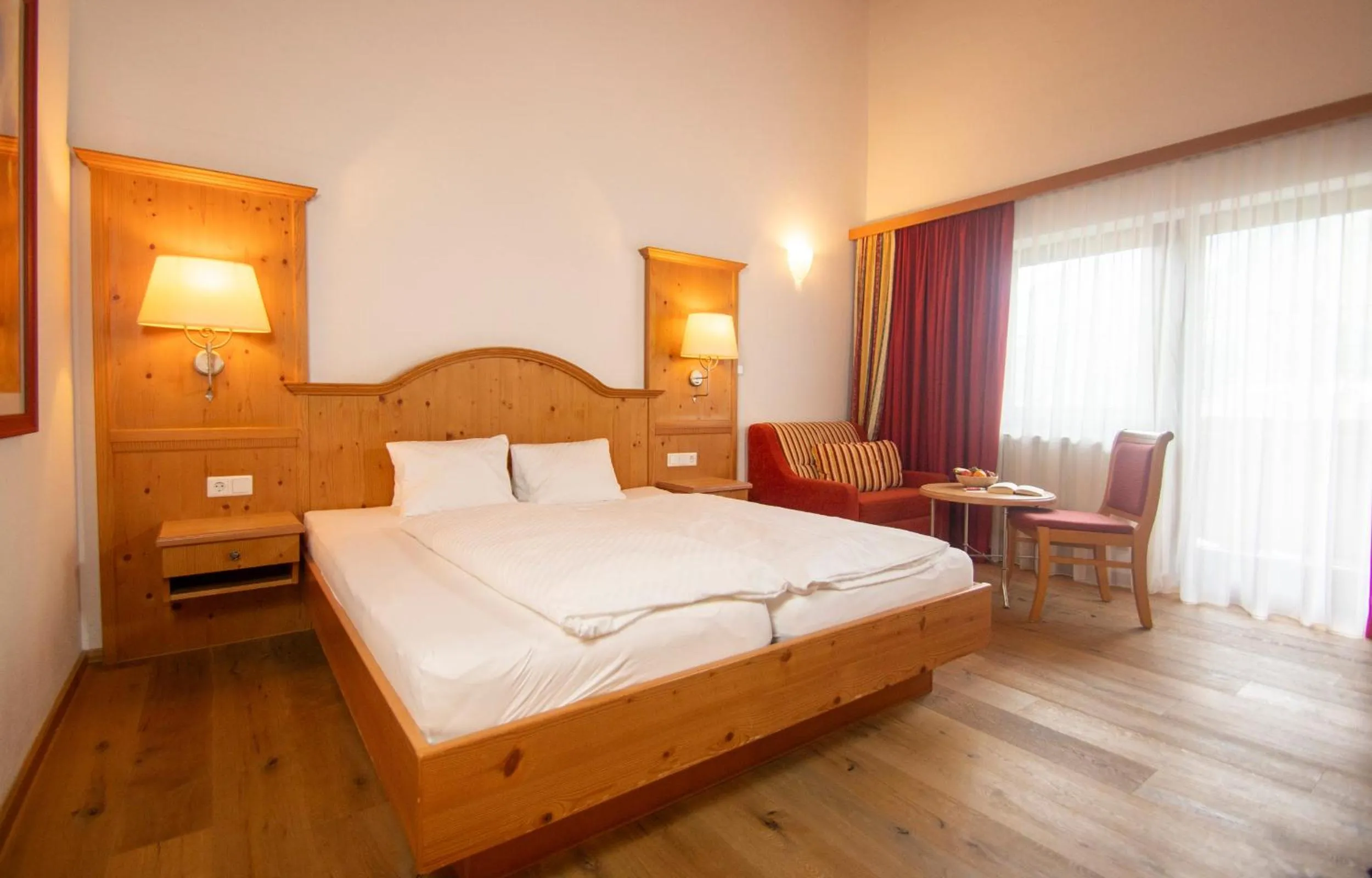 Seating area, Bed in Aktivhotel Waldhof