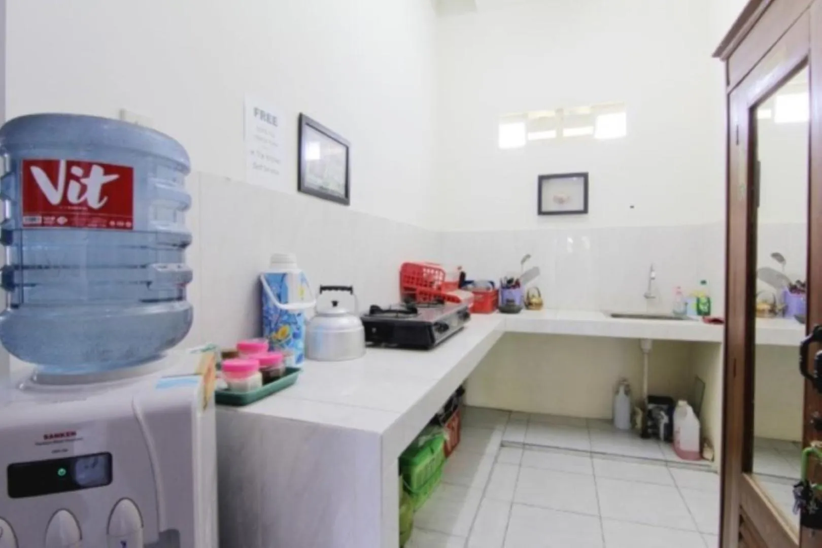 Kitchen or kitchenette in Tiga Dua Homestay