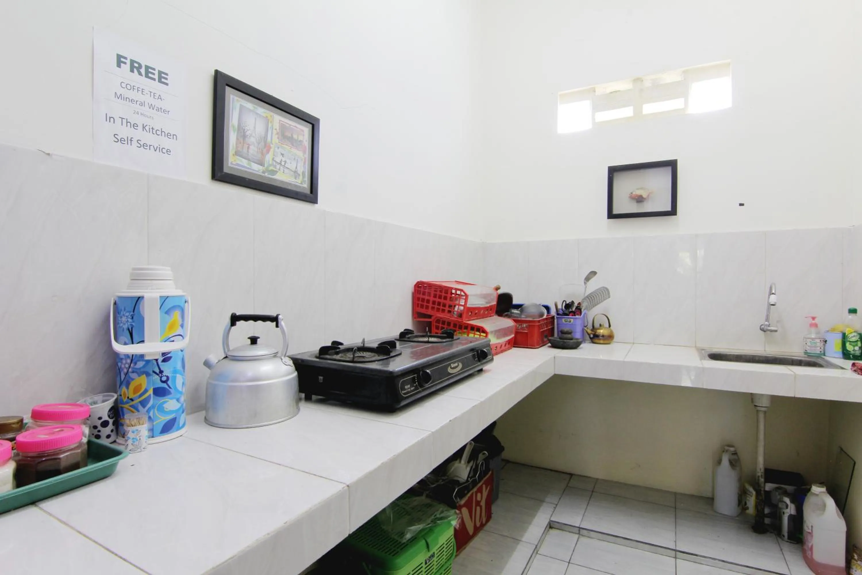 Kitchen or kitchenette in Tiga Dua Homestay