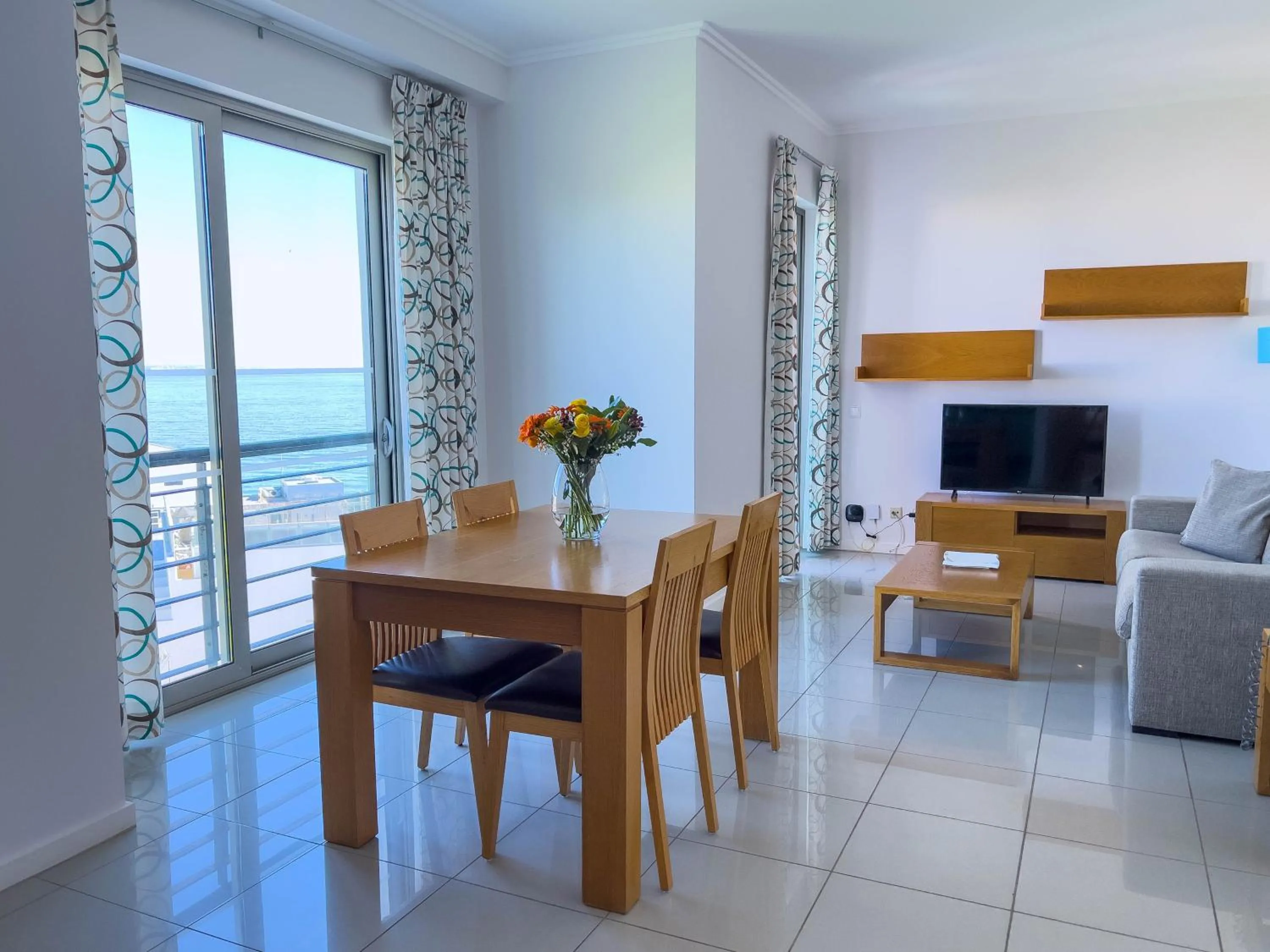 Communal lounge/ TV room in Villa Doris Suites