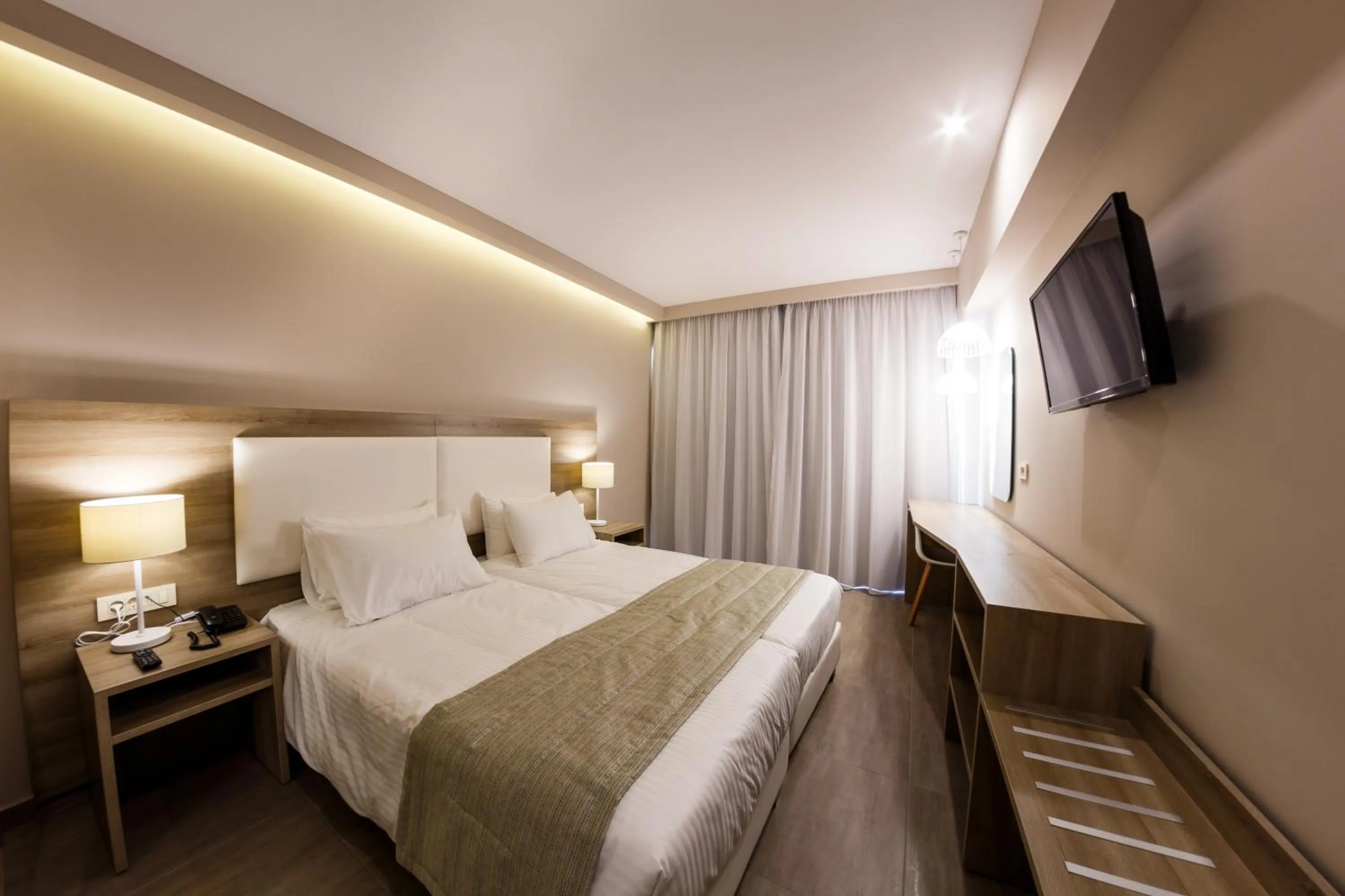 Bed in Porto Planos Beach Hotel