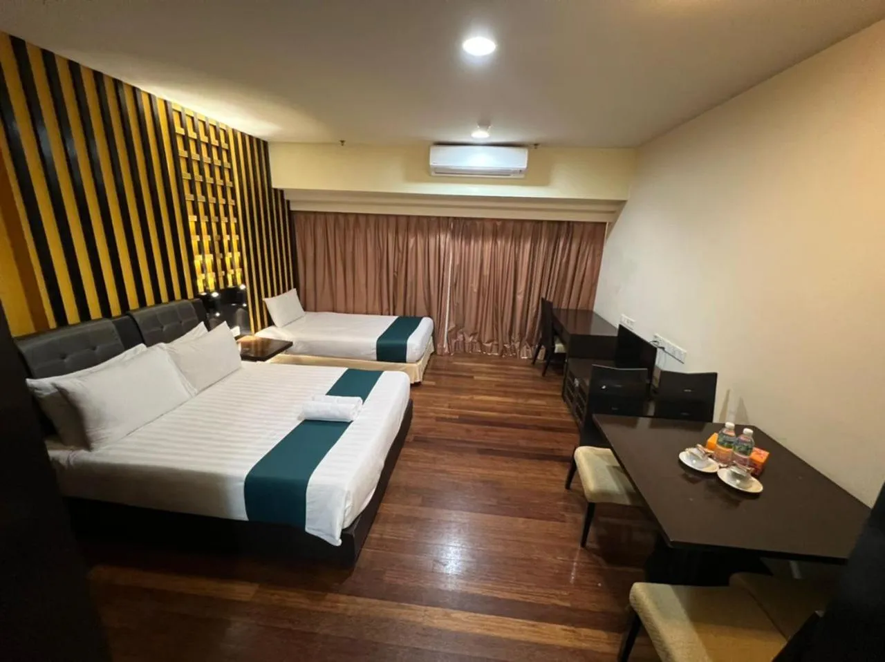 Bed in Raintree Resort Suites