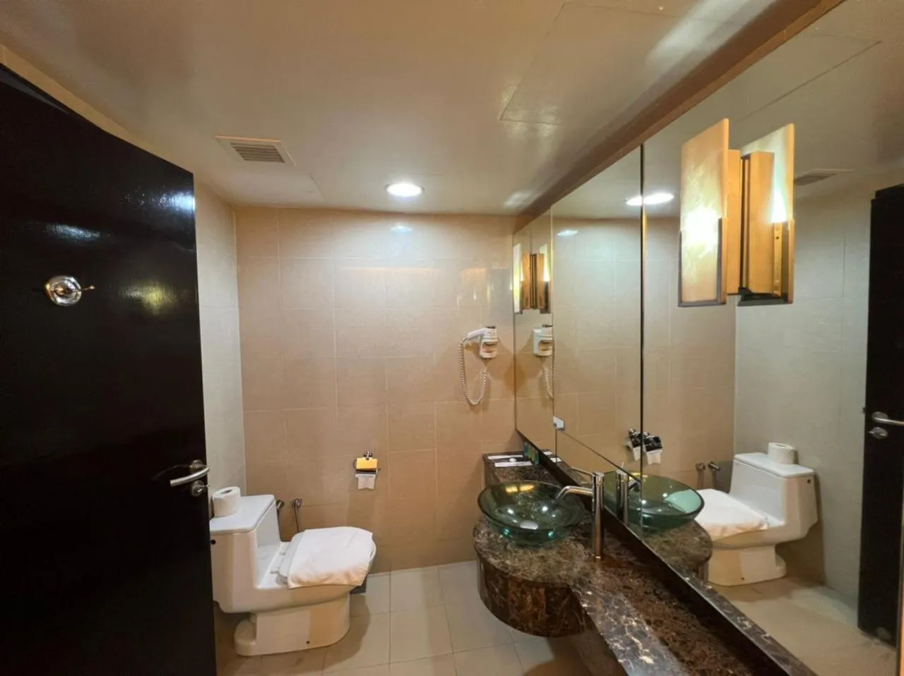 Toilet in Raintree Resort Suites