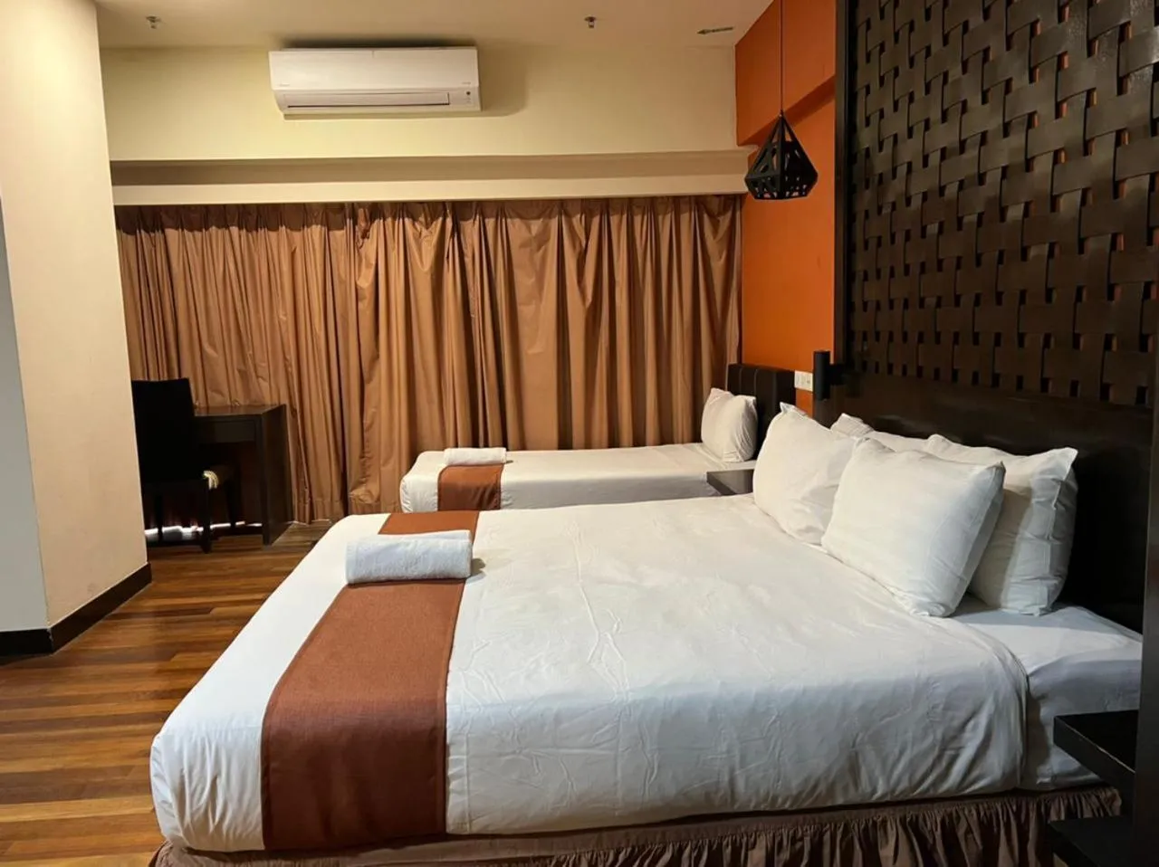 Bed in Raintree Resort Suites
