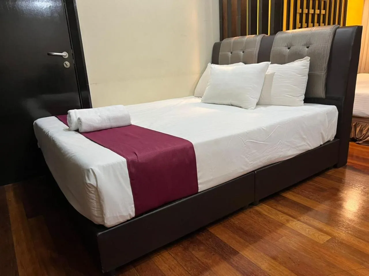 Bed in Raintree Resort Suites
